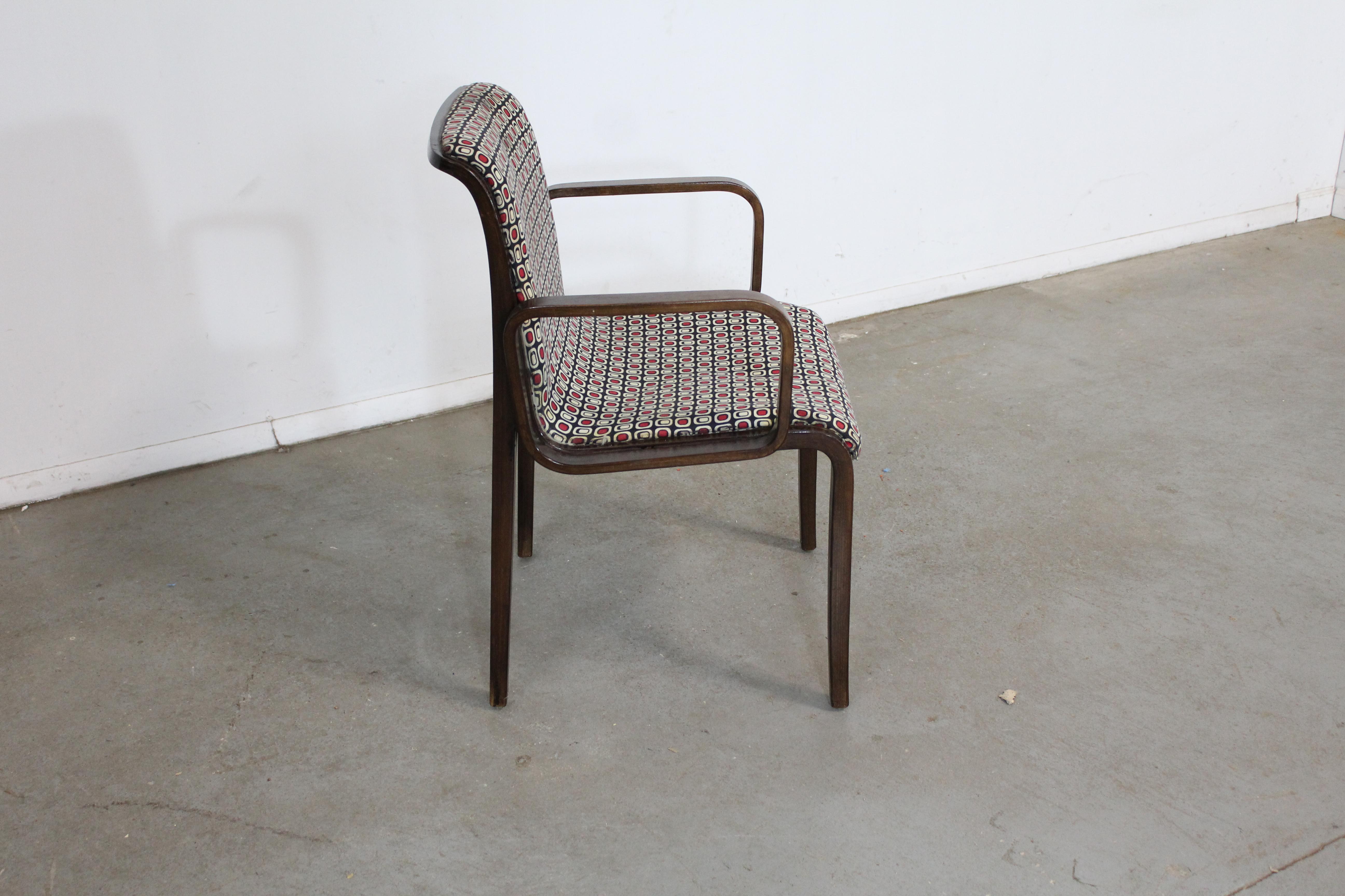 Mid-Century Danish Modern Bill Stevens Knoll walnut arm chair

Offered is a vintage mid-century arm chair (model 1305UO) designed by Bill Stevens for Knoll circa 1970. It is made with bentwood and has the original upholstery. In good condition