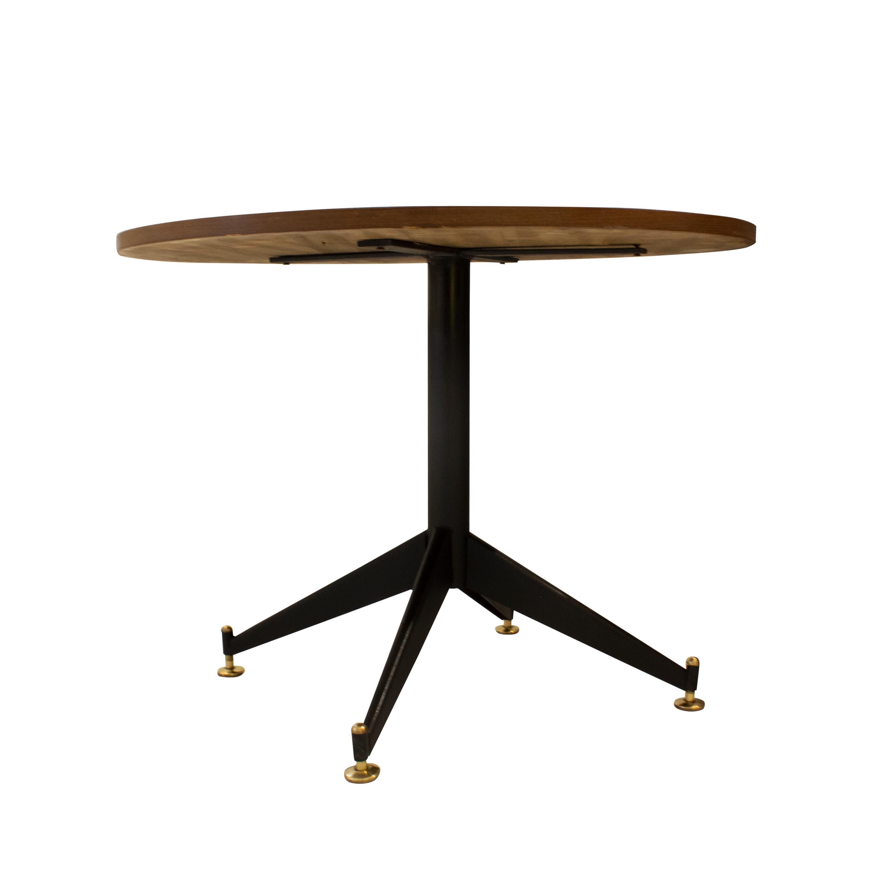 Italian rounded center table with black lacquered metal structure, birch top, and adjustable bronze pads.