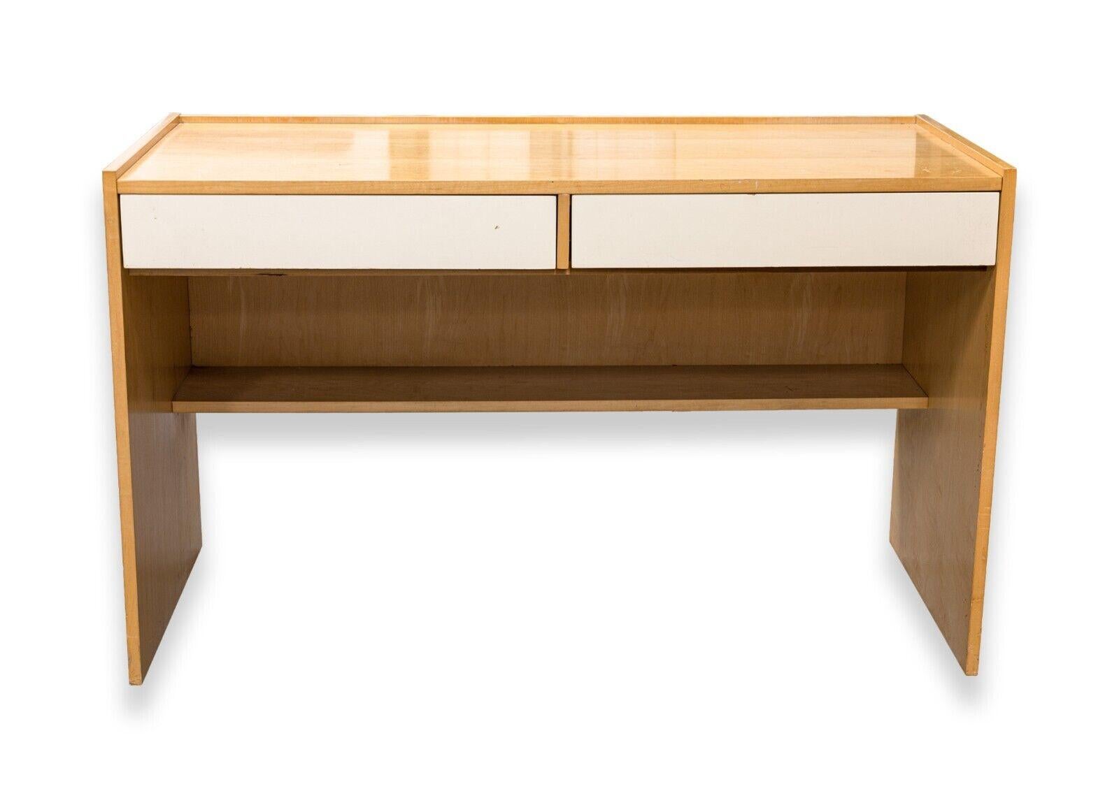 A Jack Cartwright birch wood desk for Founders Furniture. A gorgeous birch wood desk designed by Jack Cartwright. This wonderful desk features a fully wood constriction, two pull out drawers, a lower foot shelf, and a fully finished frame. The