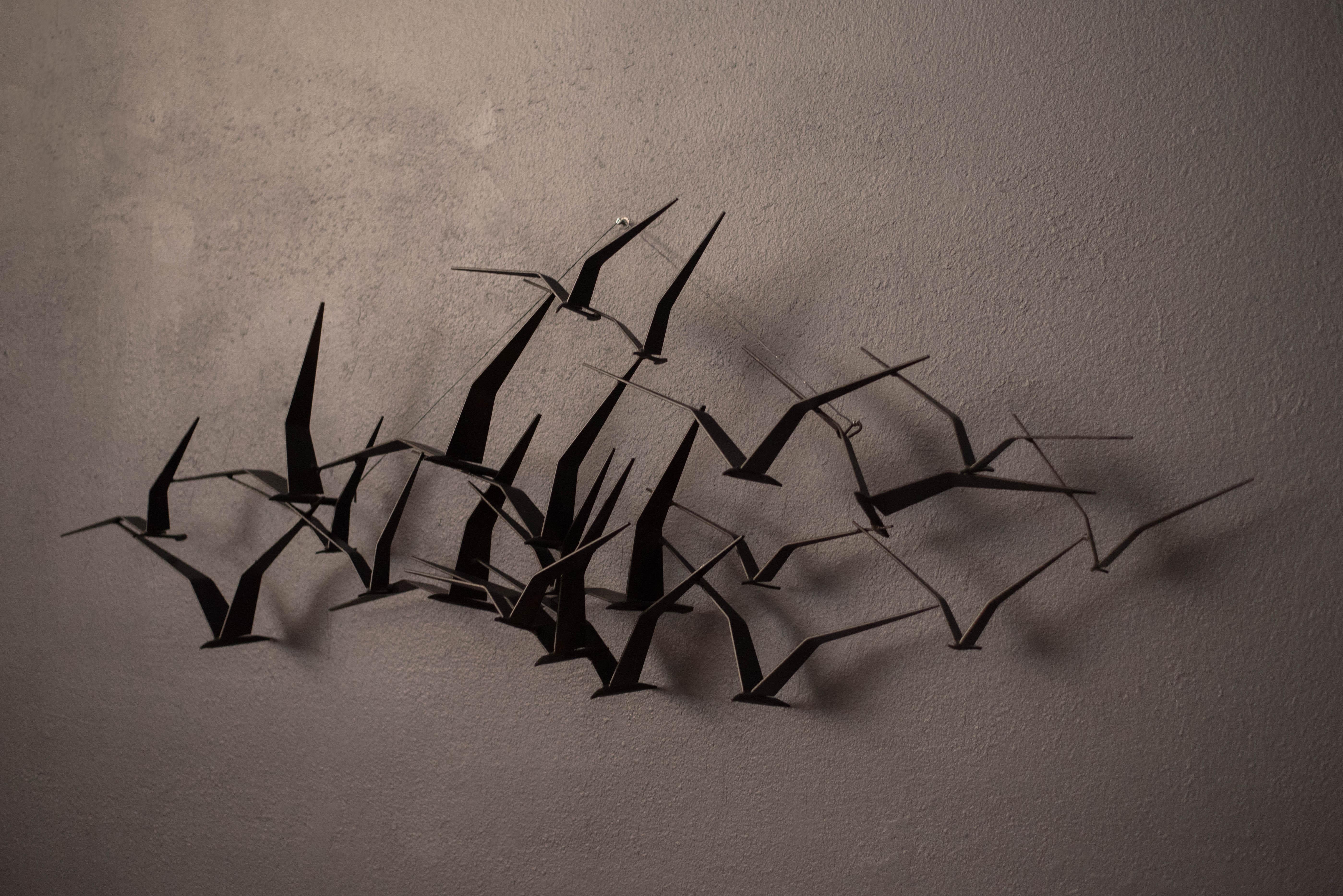 Original Curtis Jere 'Birds in Flight' sculpture for Artisan House circa 1960's. This iconic example is made of iron with a black metal finish. Makes for a great statement piece adding depth and dimension to any wall space. 