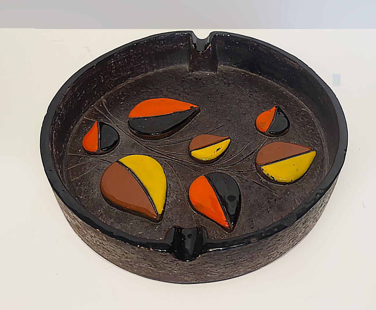 Mid-century Modern Bitossi Ceramic Ashtray, Marked, 2 available

Offered for sale is a brown ceramic Bitossi ashtray or catchall accented with orange, yellow, brown and blacks leaves on a vine. The ashtray is in very good vintage condition. There