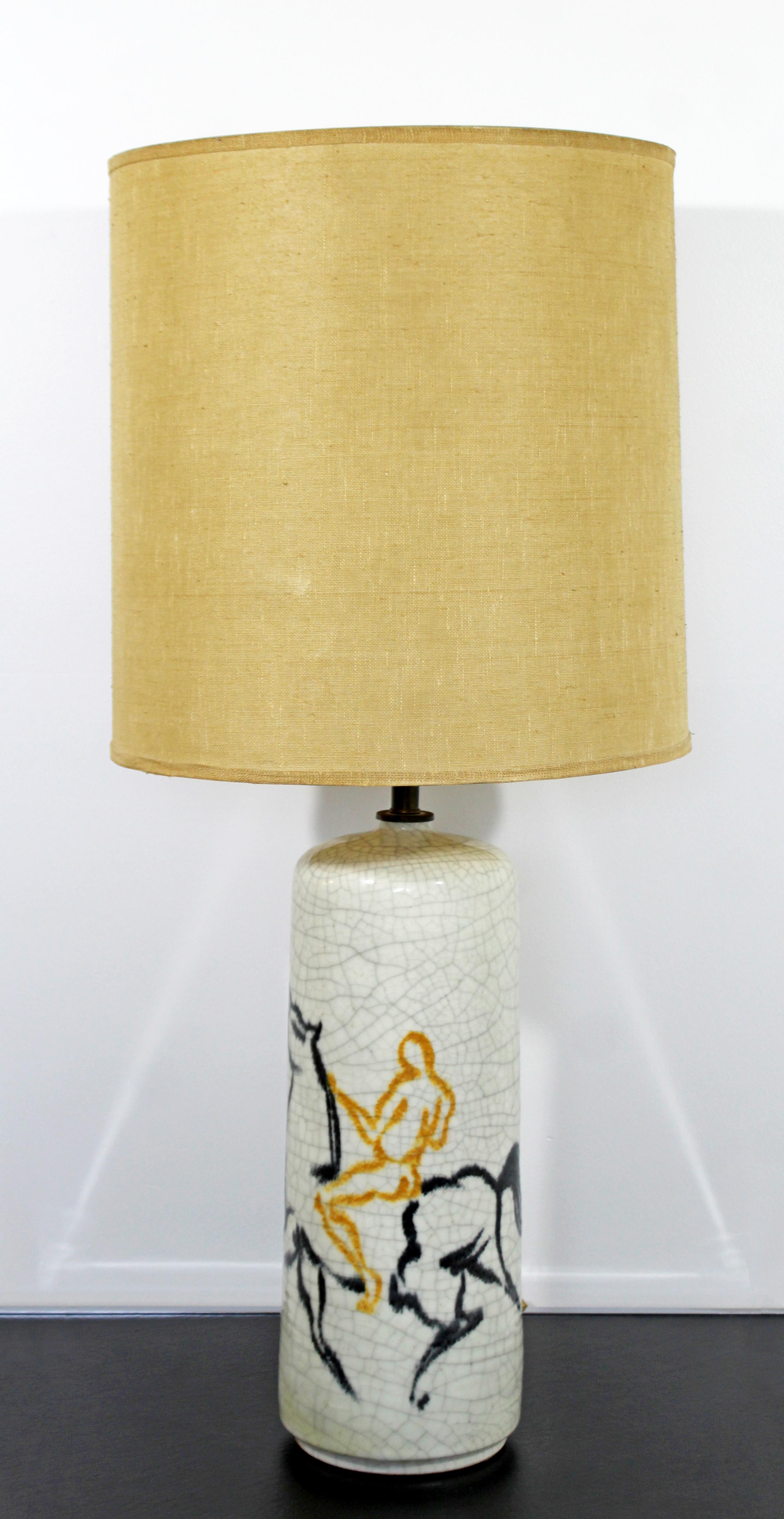 For your consideration is an incredible, white ceramic table lamp, with a horse and rider motif, with original brass finial and shade, by Bitossi, Italian, circa 1970s. In excellent condition. The dimensions of the lamp are 6.5