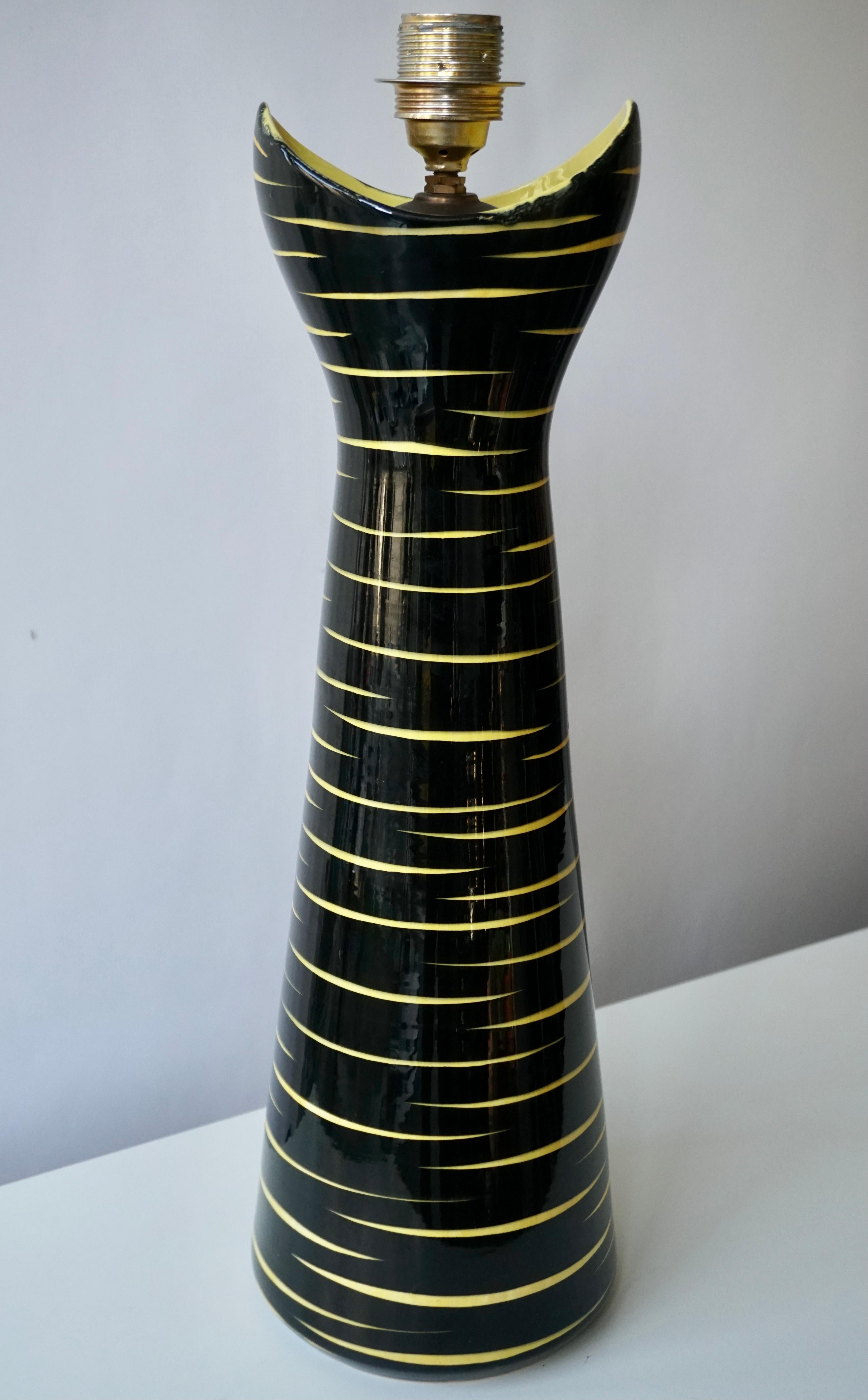 Super cool signed black and yellow ceramic table lamp, glazed finish, 21 inches to top of socket,
Germany, 1950s.
Basemark: SMF Schramberg
Brazil Dec.
   