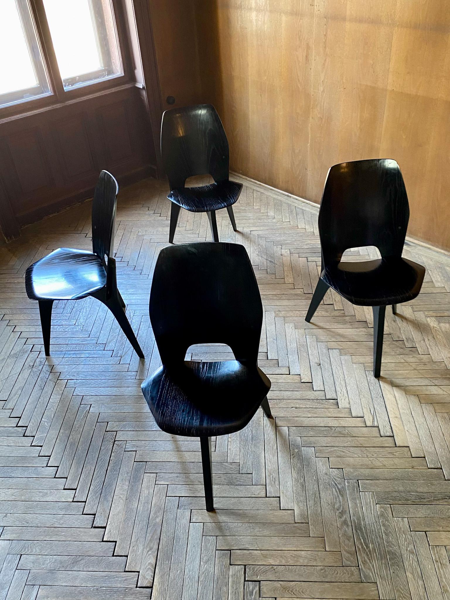 Mid-Century Modern black dining chairs by Eugenio Gerli for Tecno, Italy 1950s.

Rare set of 4 black dining chairs by Eugenio Gerli designed for the Italian manufacturer Tecno in the late 50s which reflect the skills of Italian design. These chairs
