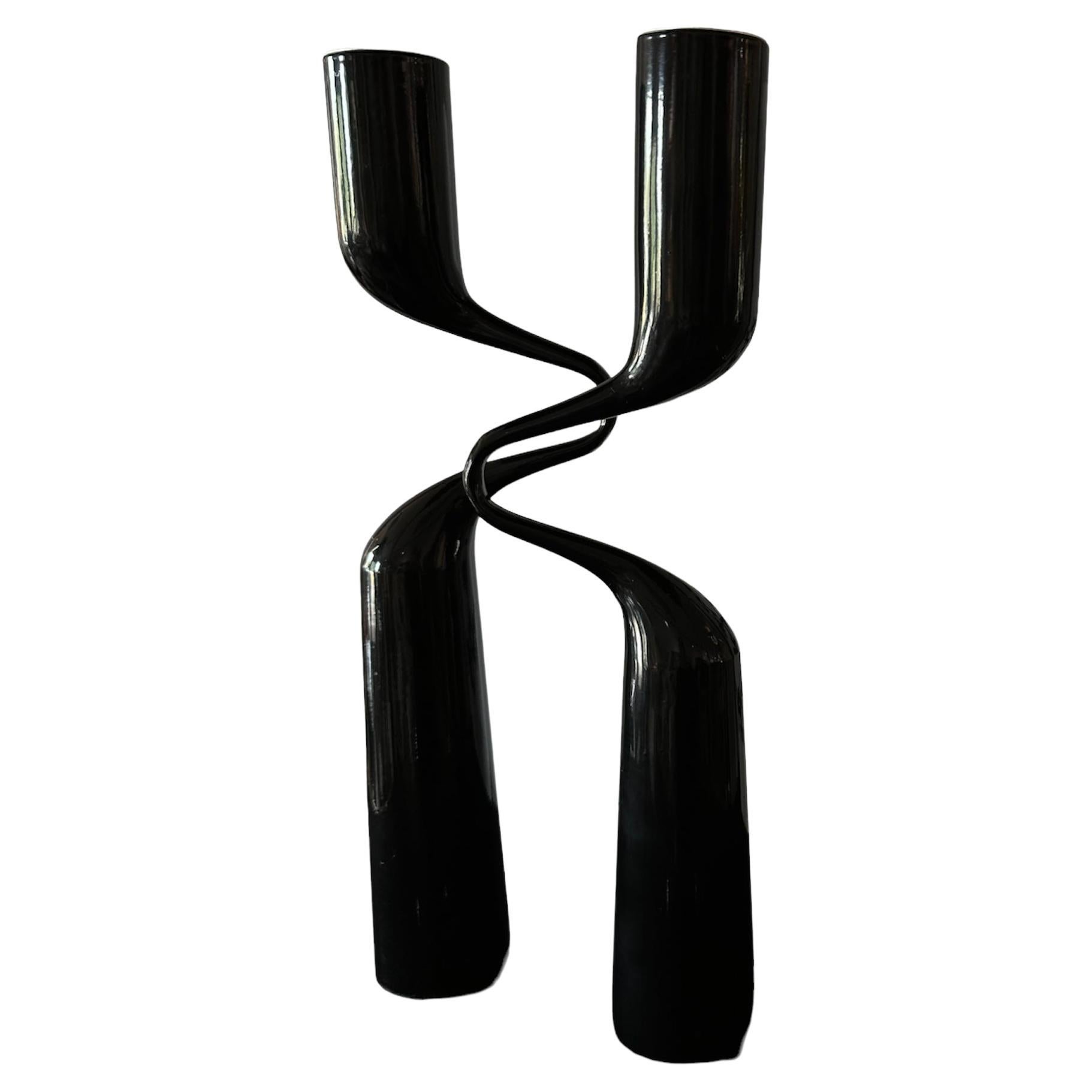This terrific pair of candlesticks was designed by Mikaela Dorfel, who is Finnish but lives in Germany, for Menu, a Danish design company specializing in “Scandinavian Design Originals.” Produced in a number of colors, this pair is black. I think