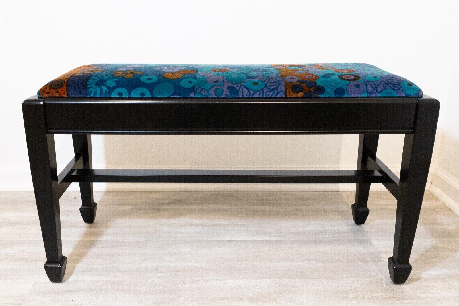 We presents this newly professionally black ebonized bench with Jack Lenor Larsen upholstery. In great condition. Dimensions: 33.5