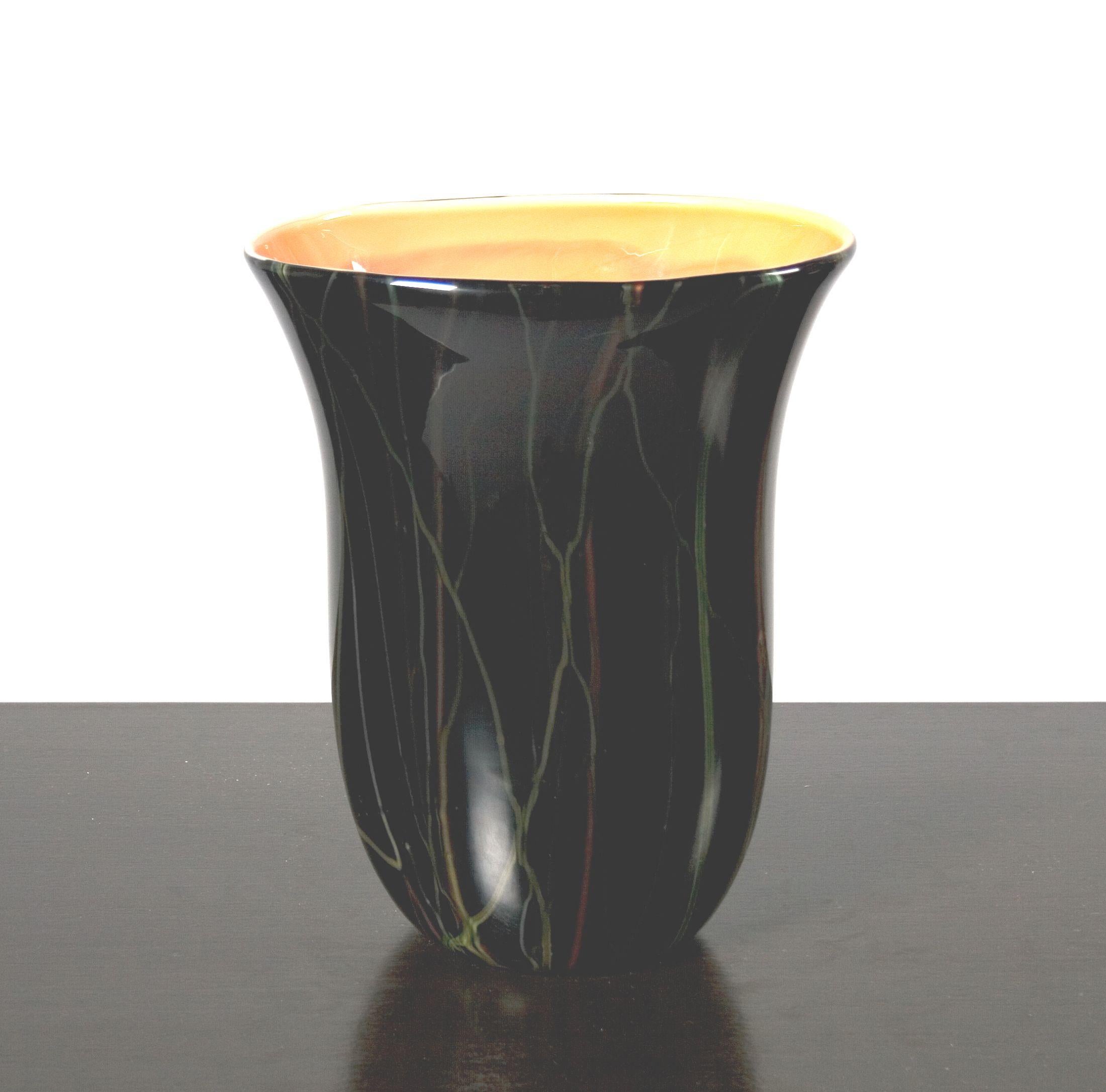 Unusual black glass vase with coral colored glass interior, signed Moretti.