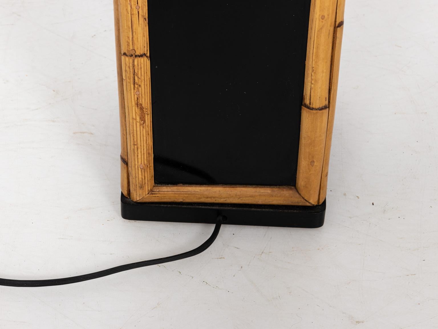 Mid-Century Modern style sleek rectangular table lamp in black lacquer, trimmed with real bamboo, circa 1960s. Shade not included. Please note of wear consistent with age. Made in the United States.