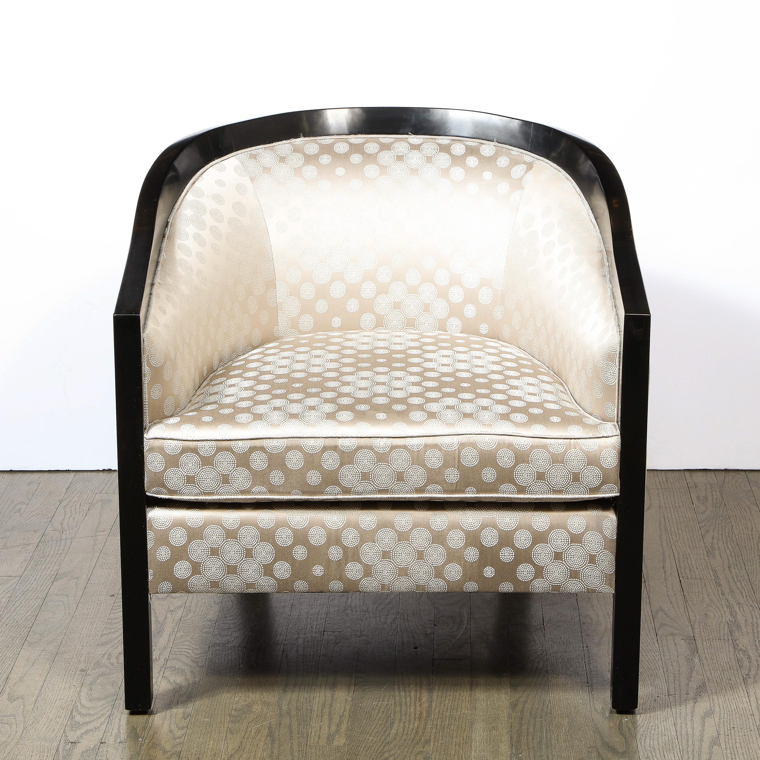 This stunning and quintessentially Mid-Century Modern barrel back lounge/club chair was designed by the illustrious American designer James Mont, circa 1950. Mont was renowned for assimilating elements of classical and Art Deco design into a modern