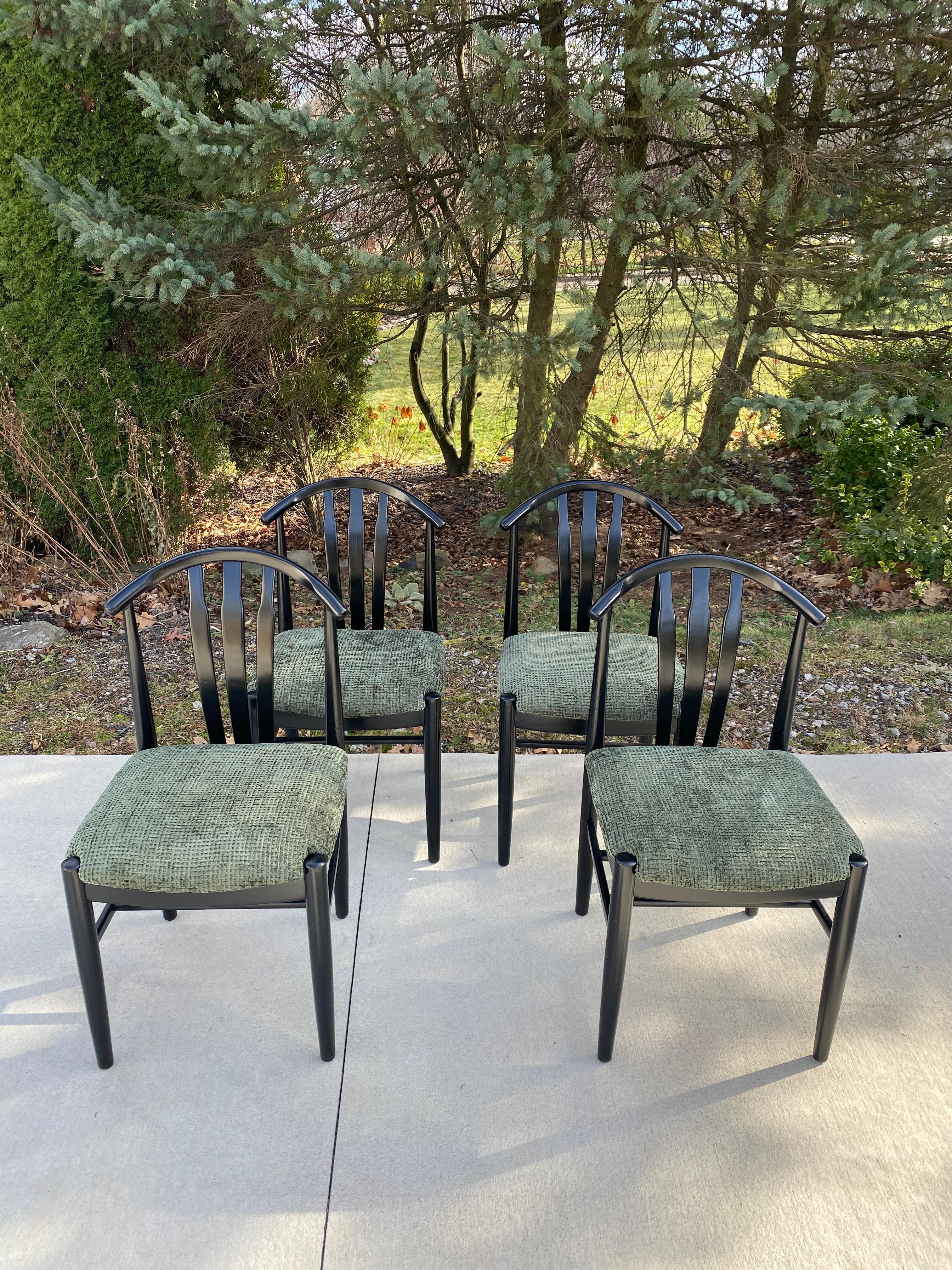 Beautiful set of 4 wishbone dining chairs, newly refinished in black lacquer and reupholstered in a gorgeous textured green velvet fabric. There are a few imperfections in the wood, see pictures but hardly noticeable because of the new lacquer