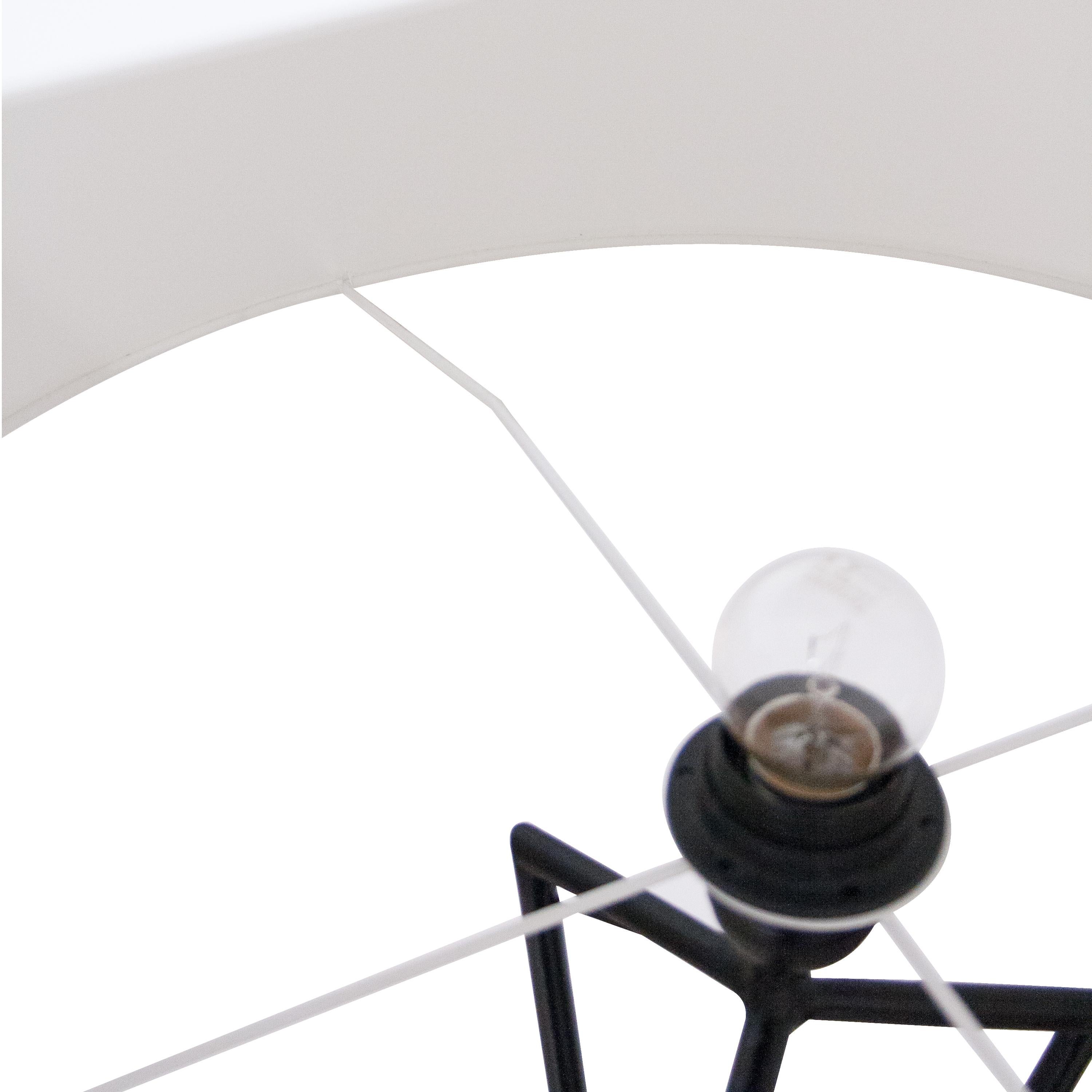 French black lacquered flor lamp with white shade, details in bronze original from the 1950's.