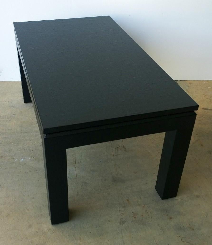 Offered is a Mid-Century Modern to later 20th century modern chinoiserie style newly lacquered in black grass cloth Harrison Van Horn coffee / cocktail / low table. This is a stunning little chinoiserie in style gem with its clean lines and dramatic