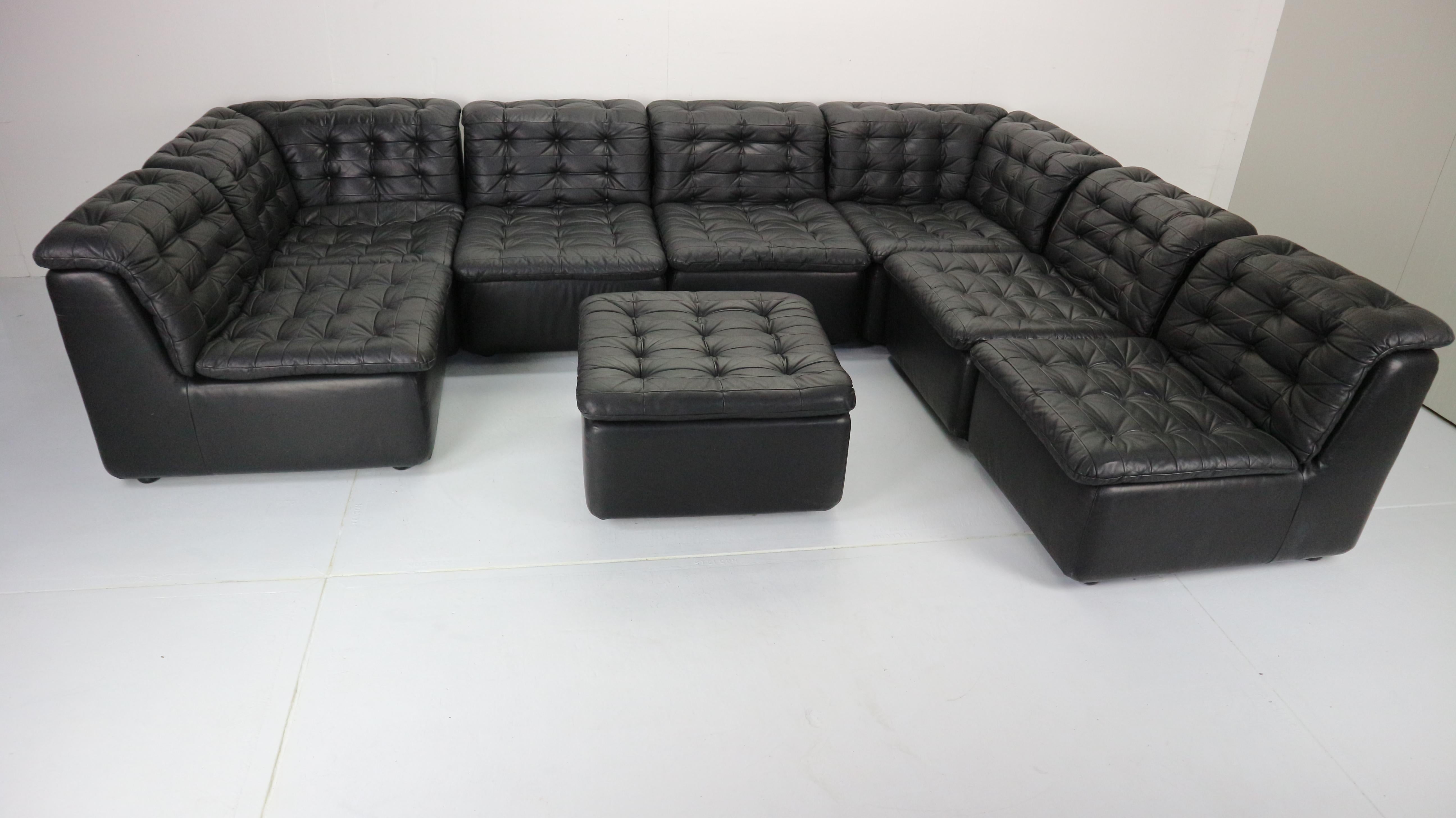 Mid-Century Modern design seven-seat sofa made in 1970s.
This sofa comes within an ottoman and seven sectional pieces witch you can easily move around and make your own comfortable design connecting with metal connecters of the bottom of the couch