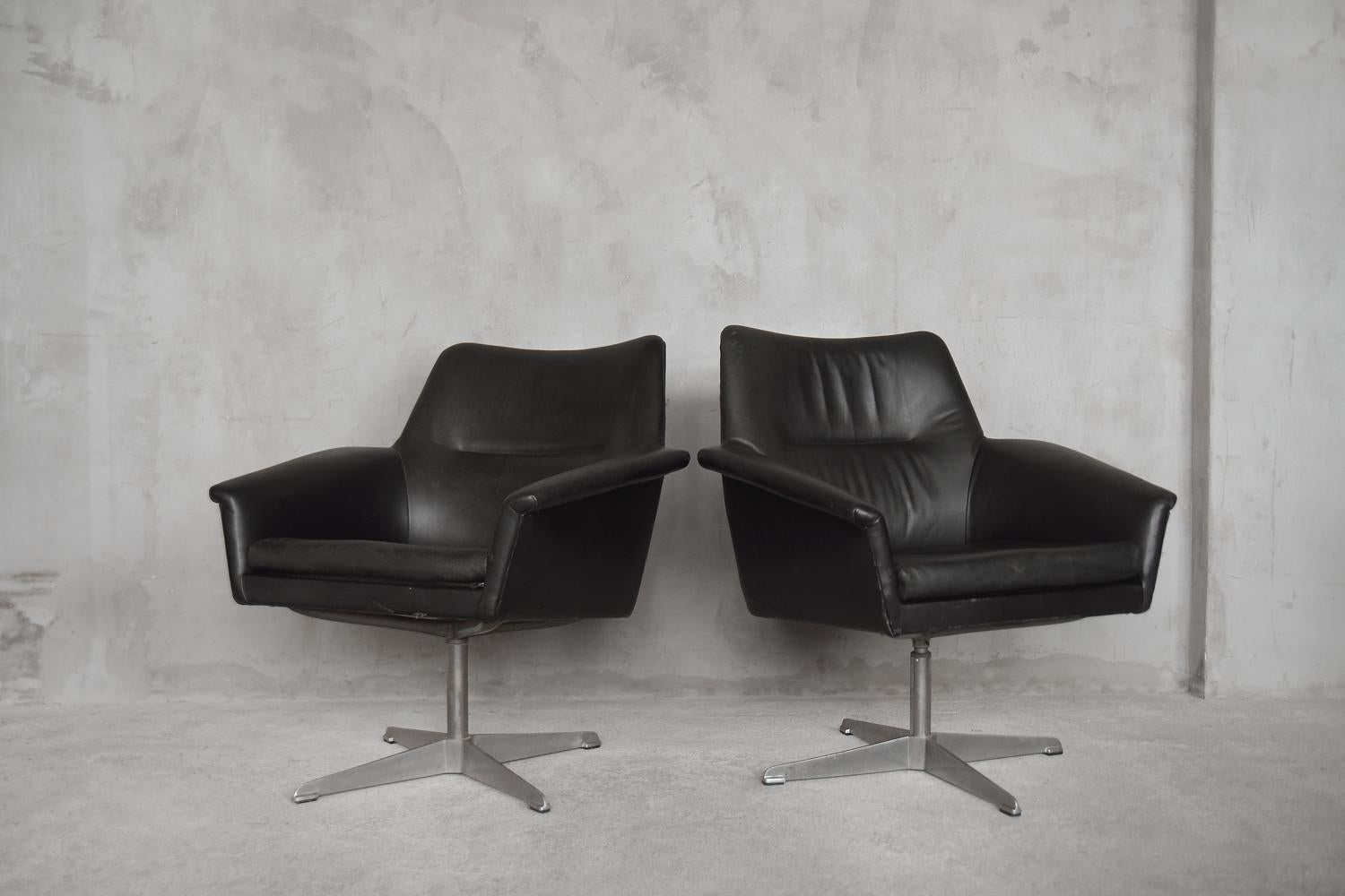 Rare, leather armchairs were manufactured by Ire Möbel AB in Sweden during the 1960s. The armchairs were upholstered in natural black leather and have a metal, swivel base. The pieces are perfect for the office.

Ire was founded in 1939 in