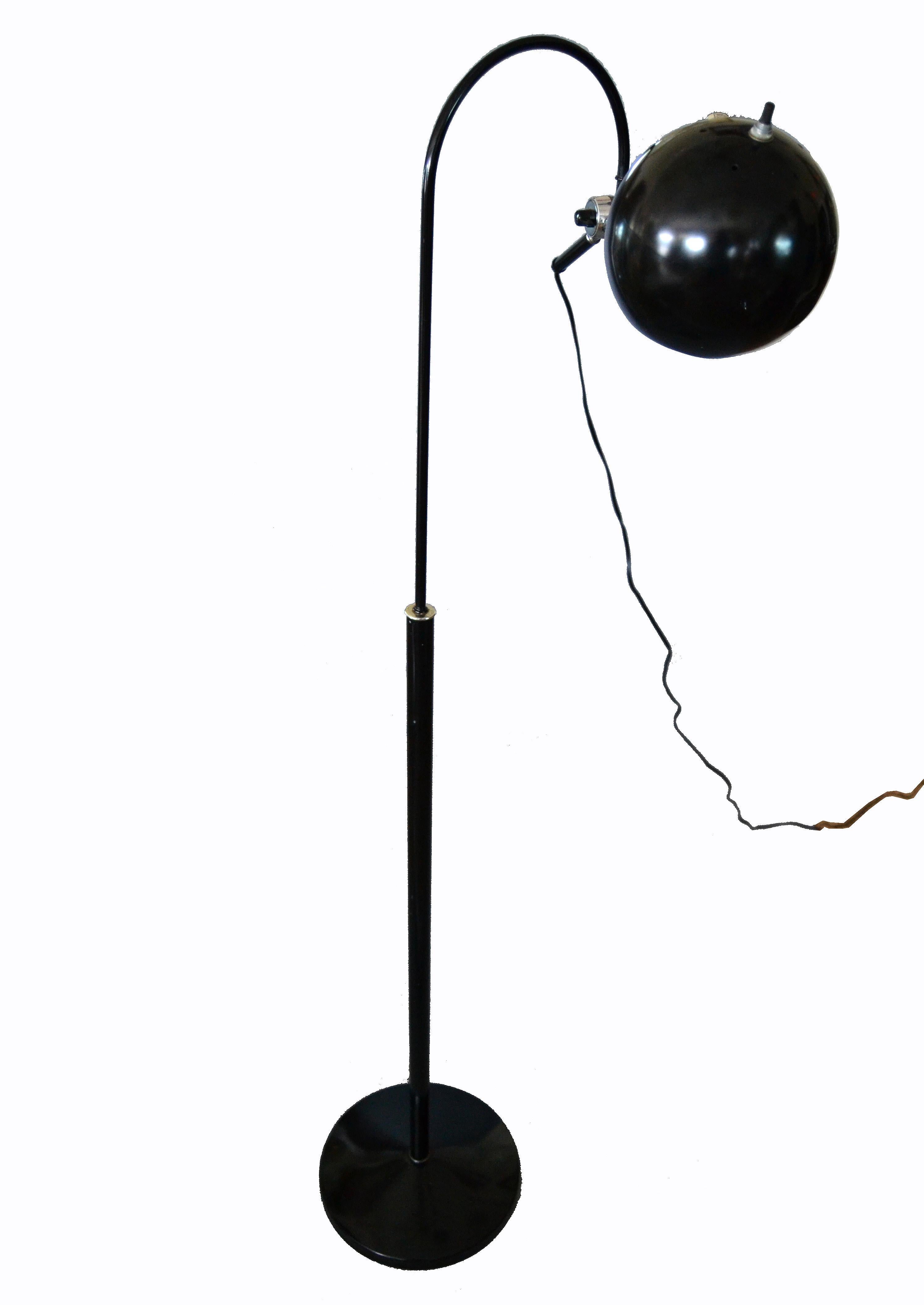 Mid-Century Modern swing arm black metal floor lamp with round ball shade.
Uses a max. 60 watts light bulb and has a switch at the round shade.
Can be positioned in different angles for the perfect reading light.
     