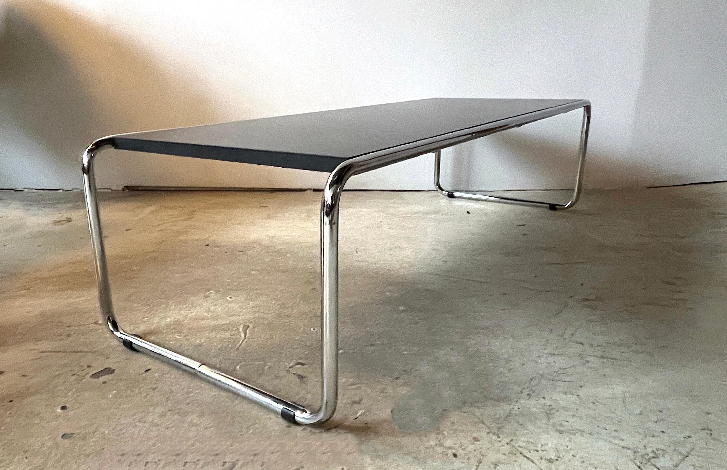 Reproduction of American International-Style (circa 1924) 'Laccio' coffee table with a black rectangular top supported on a chrome plated steel tube frame. Attributed to Marcel Breuer for Knoll, however there are no makers marks. 

Measures 52