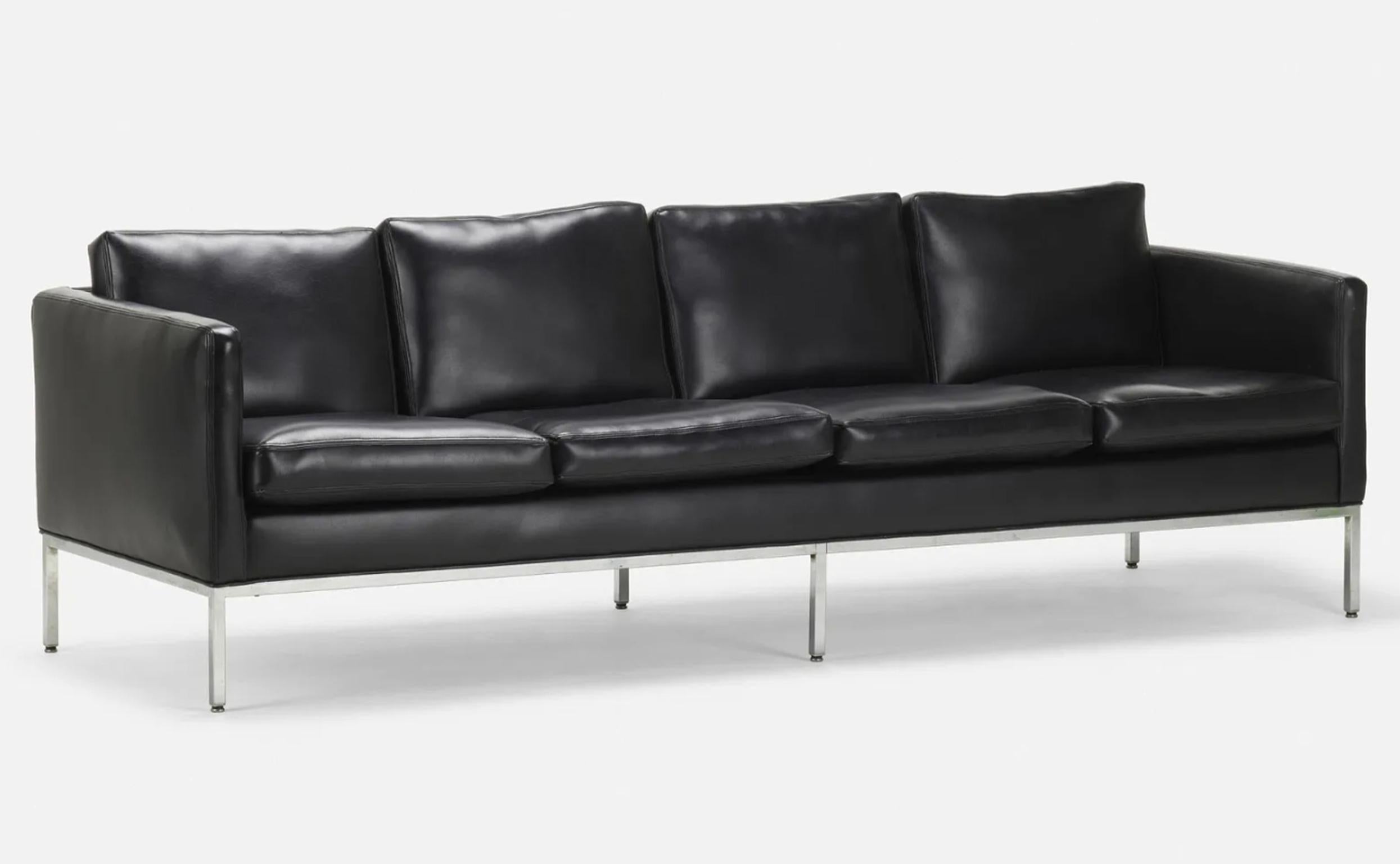 Mid-Century Modern black Naugahyde faux leather chrome sofa 93” long. Very high quality 4 seat Mid-Century Modern sofa in the style of Florence Knoll. Black soft naugahyde faux leather. Sits on a 6 leg chrome plated steel frame base. Very clean sofa