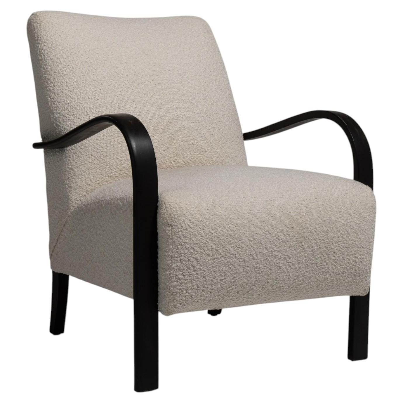 Sillón de estilo «Mid-Century Modern» con pátina negra y tapizado de bouclé, siglo XX