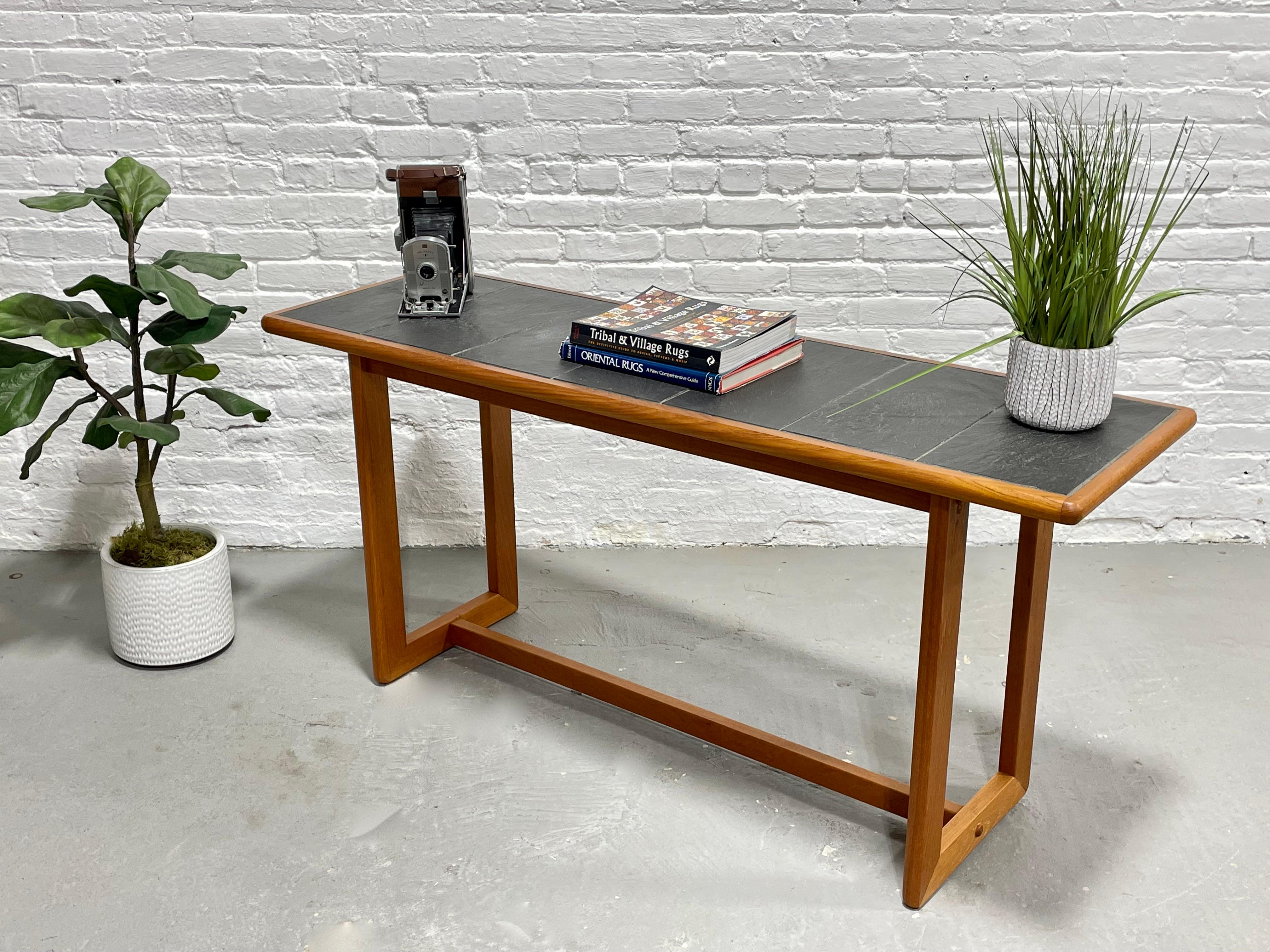 Mid-Century Modern slate title teak console table, circa 1960s. This simple and sleek table is perfect for placing behind a sofa or in a hallway or entryway with your favorite vase, lamp or other décor on top. In lovely condition with minimal wear