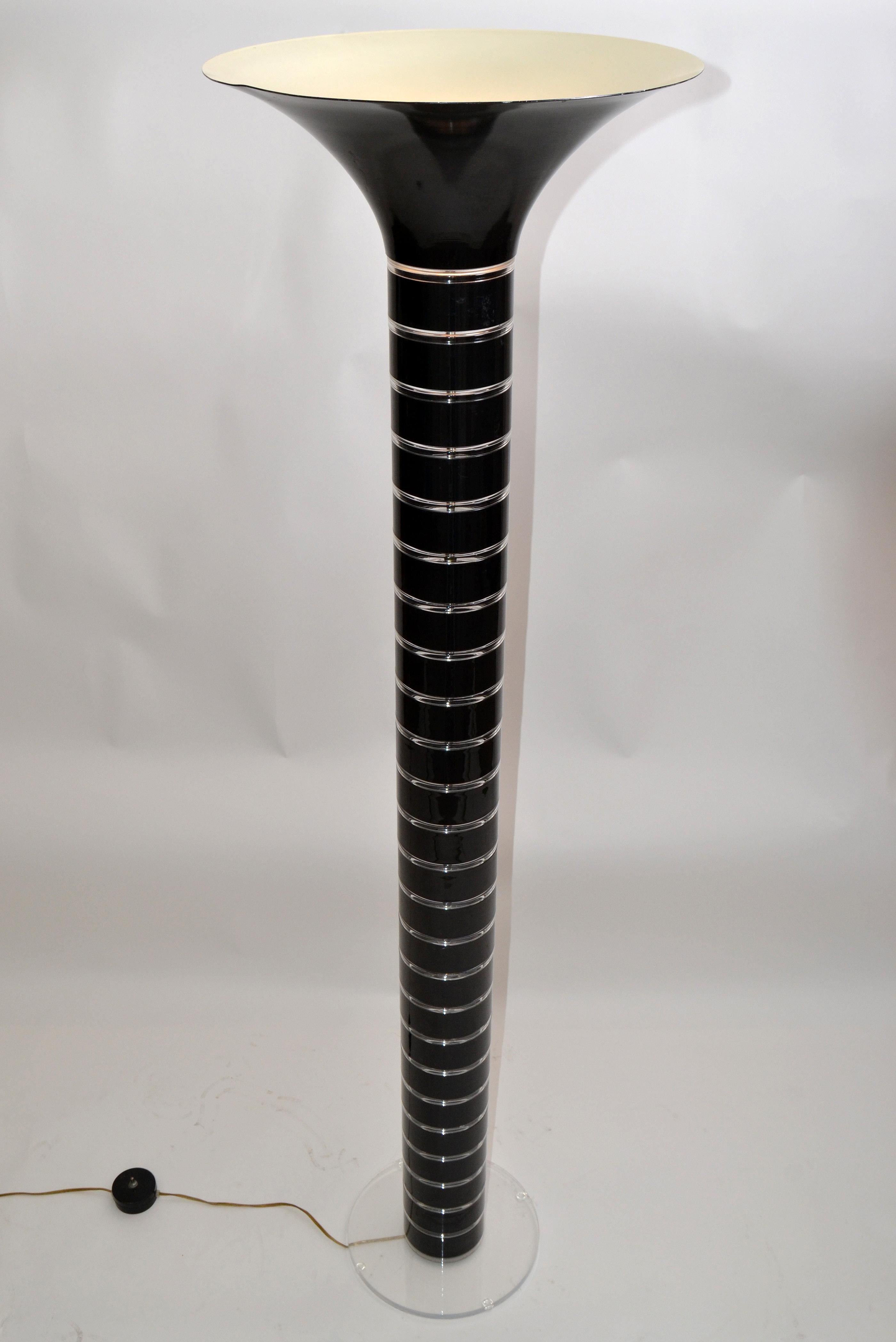 Stacked black acrylic segments separated by transparent Lucite rings tall floor lamp.
The top cone shade part is made of metal and painted in black and white enamel.
The clear base of the Floor Lamp is 12 inches in diameter.
Perfect working
