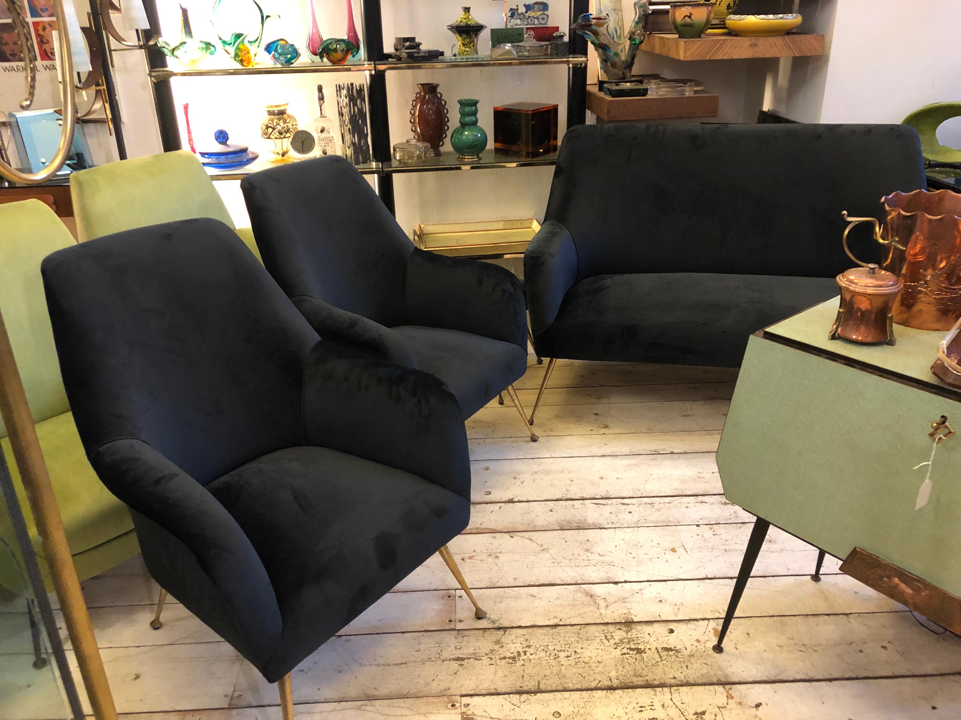 A Mid-Century Modern Living room seating set composed by a Sofa, two armchairs and two stools in the manner of Minotti, made in Italy in the 1950s, has been upholstered with a gorgeous black velvet. 