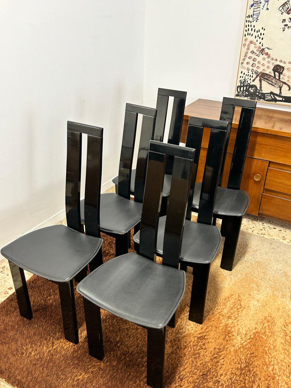 Mid-Century Modern vintage set of six black dining chairs designed by Pietro Costantini from solid black lacquered beechwood.
The seats are covered with black leather.