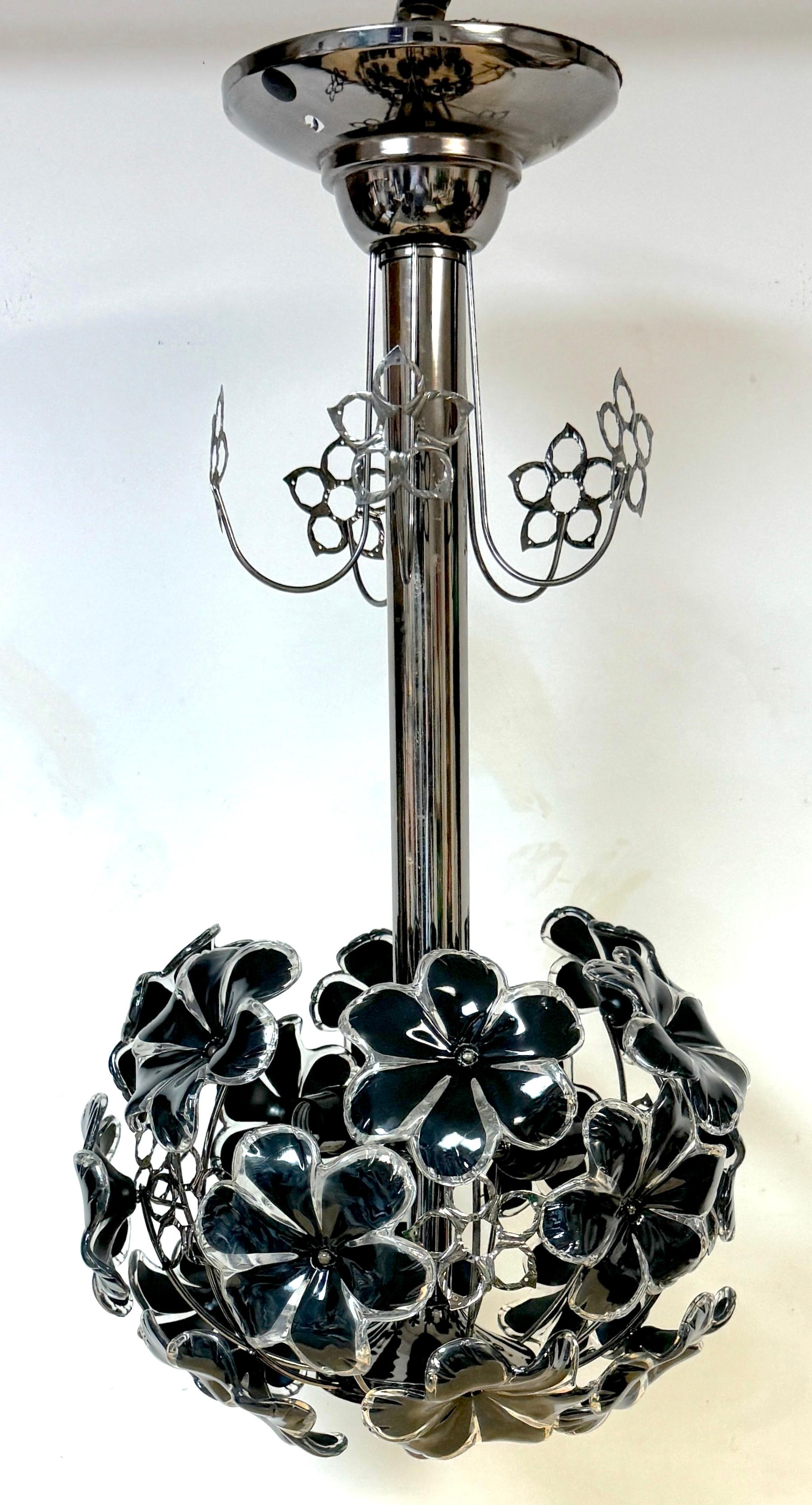 Mid Century Modern Black & White Lucite Floral Chandelier / Pendant 
USA, circa 1970s

A stunning mid-century modern black and white Lucite floral chandelier, circa 1970s, USA. This whimsical, pop-art-influenced piece brings a touch of playful