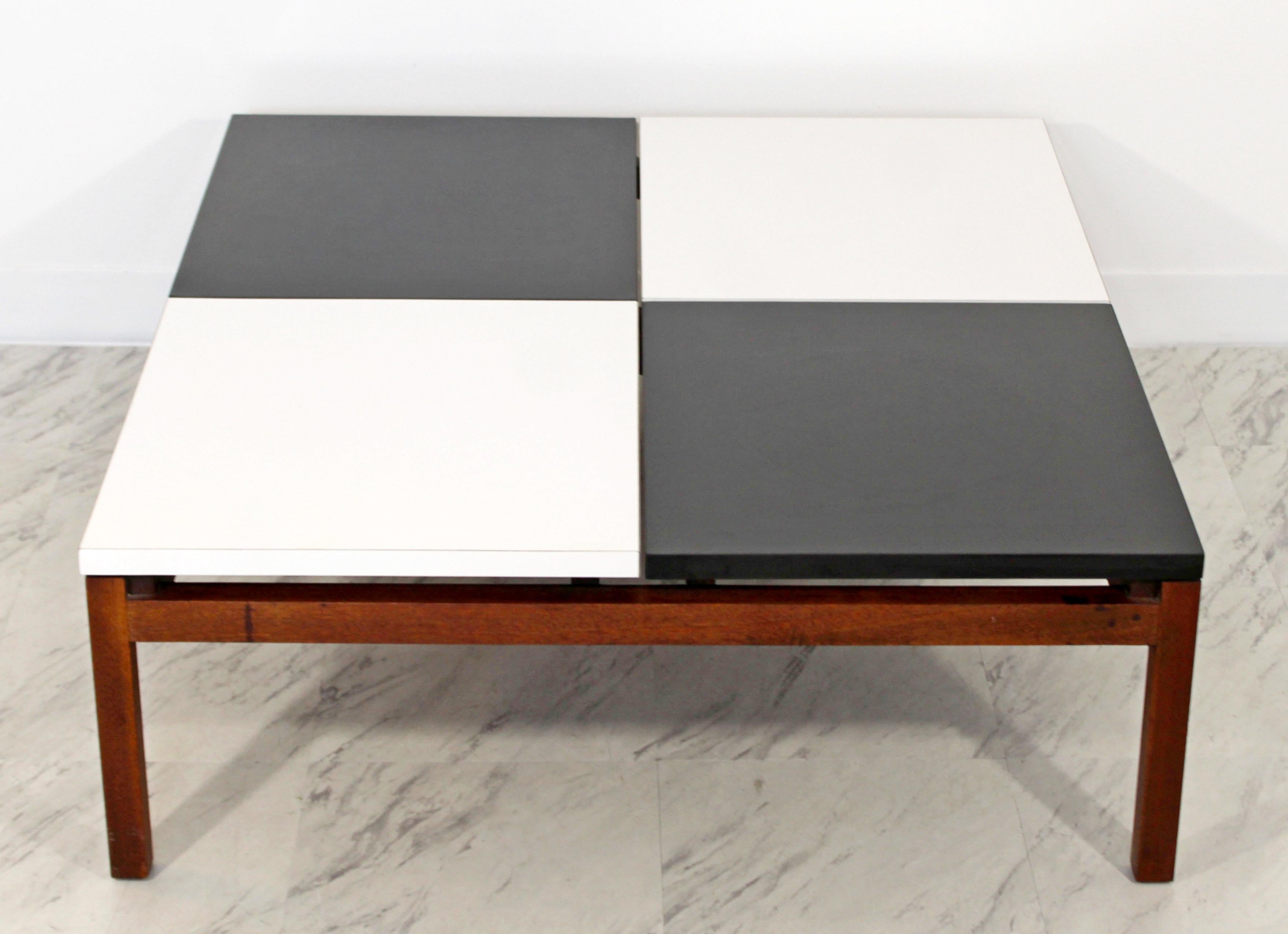 For your consideration is an extraordinary coffee table, with a segmented black and white formica top, on a solid wood base, by Lewis Butler for Knoll, circa 1960s. In very good condition. The dimensions are 38