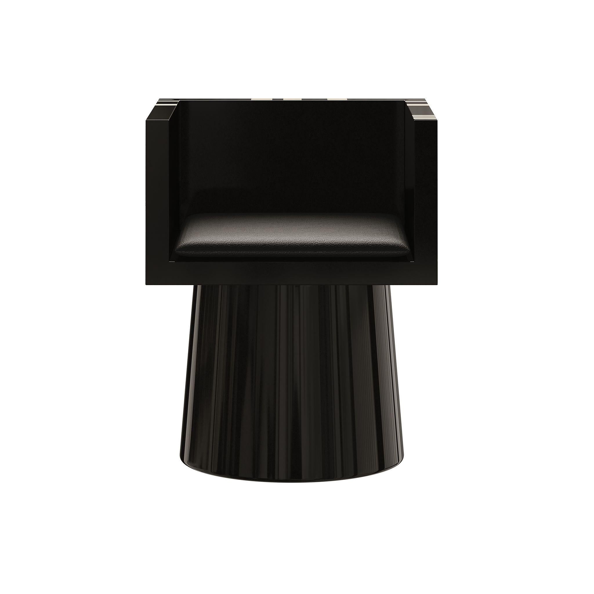 The Cubo Chair is a modern dining chair that is both functional furniture and an art piece in your dining room decor. Crafted from black lacquered wood, it features an abstract pattern on the backrest, making it a unique statement of exceptional