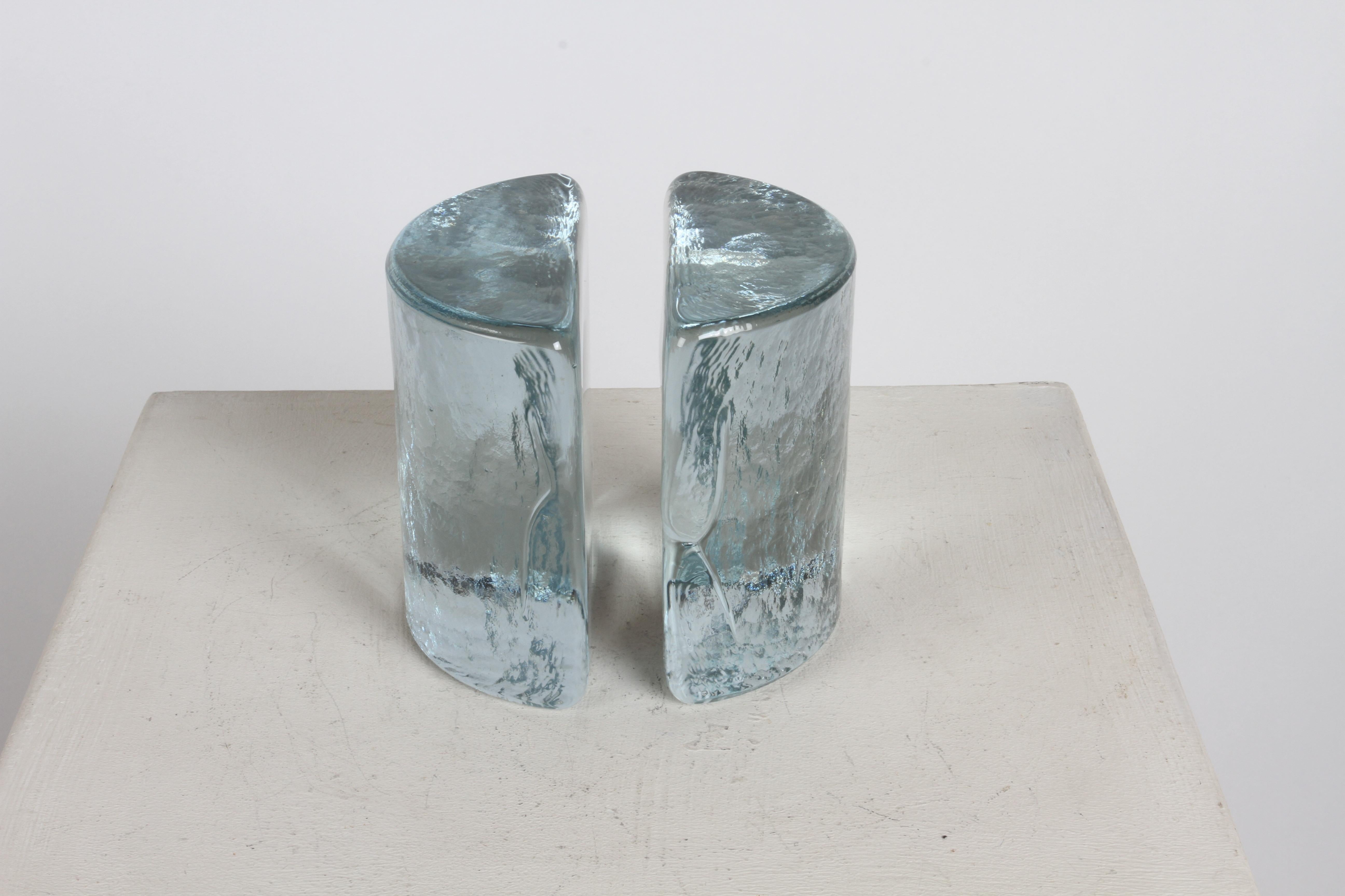 Pair of Wayne Husted designed clear half glass bookends for Blenko, circa 1960s. In fine condition, no damage. Original Label, possible model # 434.