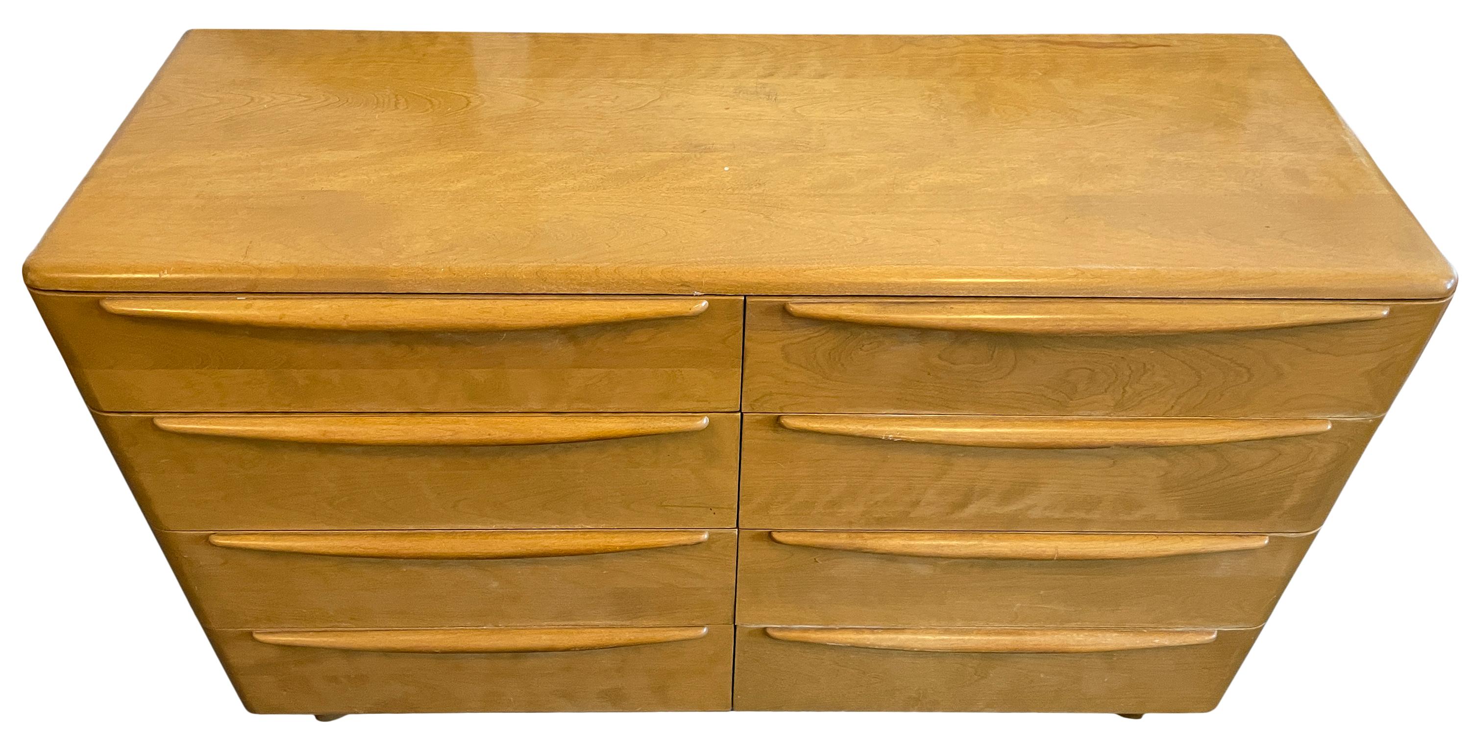 Mid-Century Modern Blonde solid Maple 8 Drawer dresser by HEYWOOD WAKEFIELD. Good Vintage Condition clean inside and out. Drawers slide smooth. Very unique mid century and deco design. Labeled in drawer. Located In Brooklyn NYC.