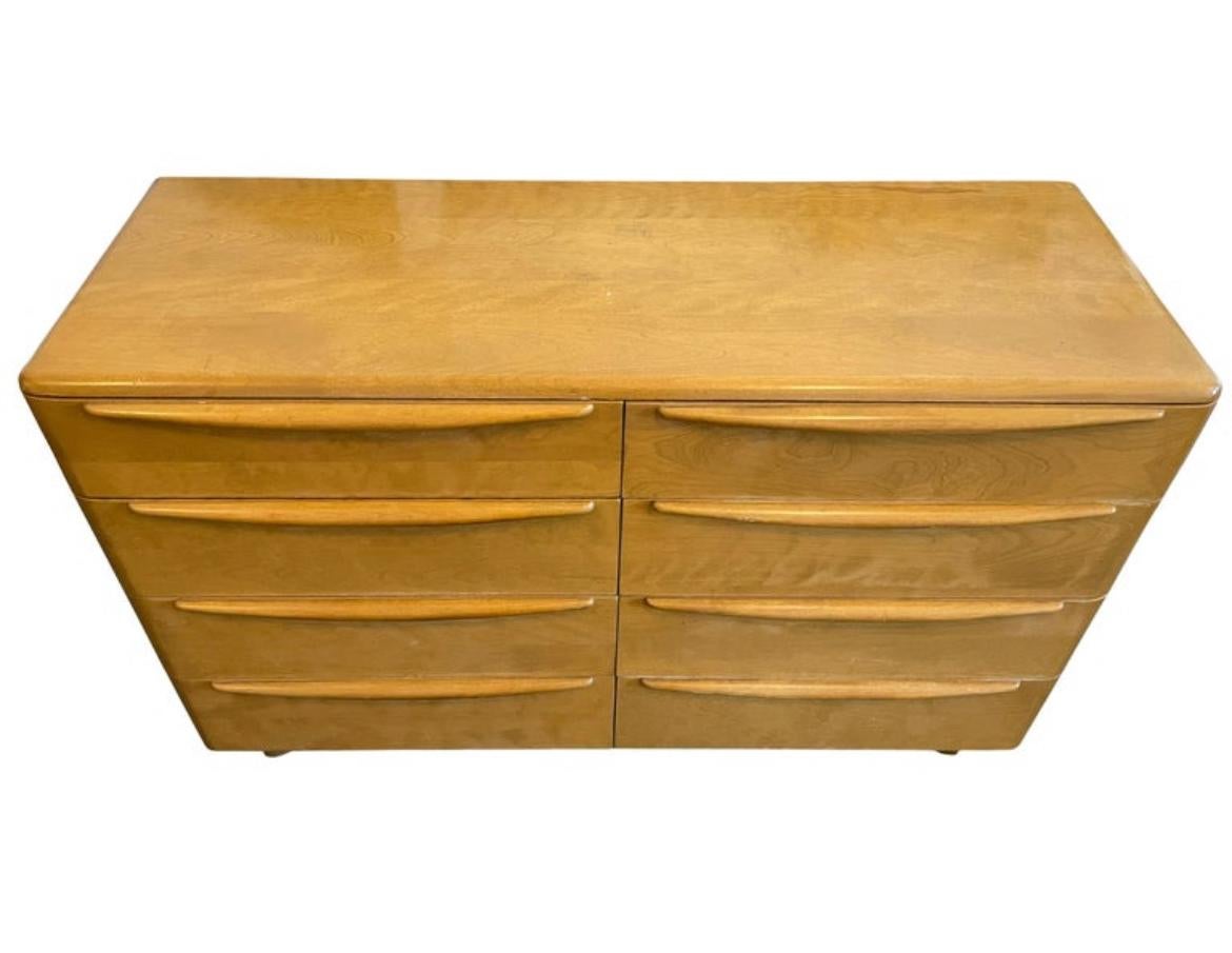 Mid-Century Modern Blonde solid Maple 8 Drawer dresser by HEYWOOD WAKEFIELD. Good Vintage Condition clean inside and out. Drawers slide smooth. Very unique mid century and deco design. Labeled in drawer. Located In Brooklyn NYC.