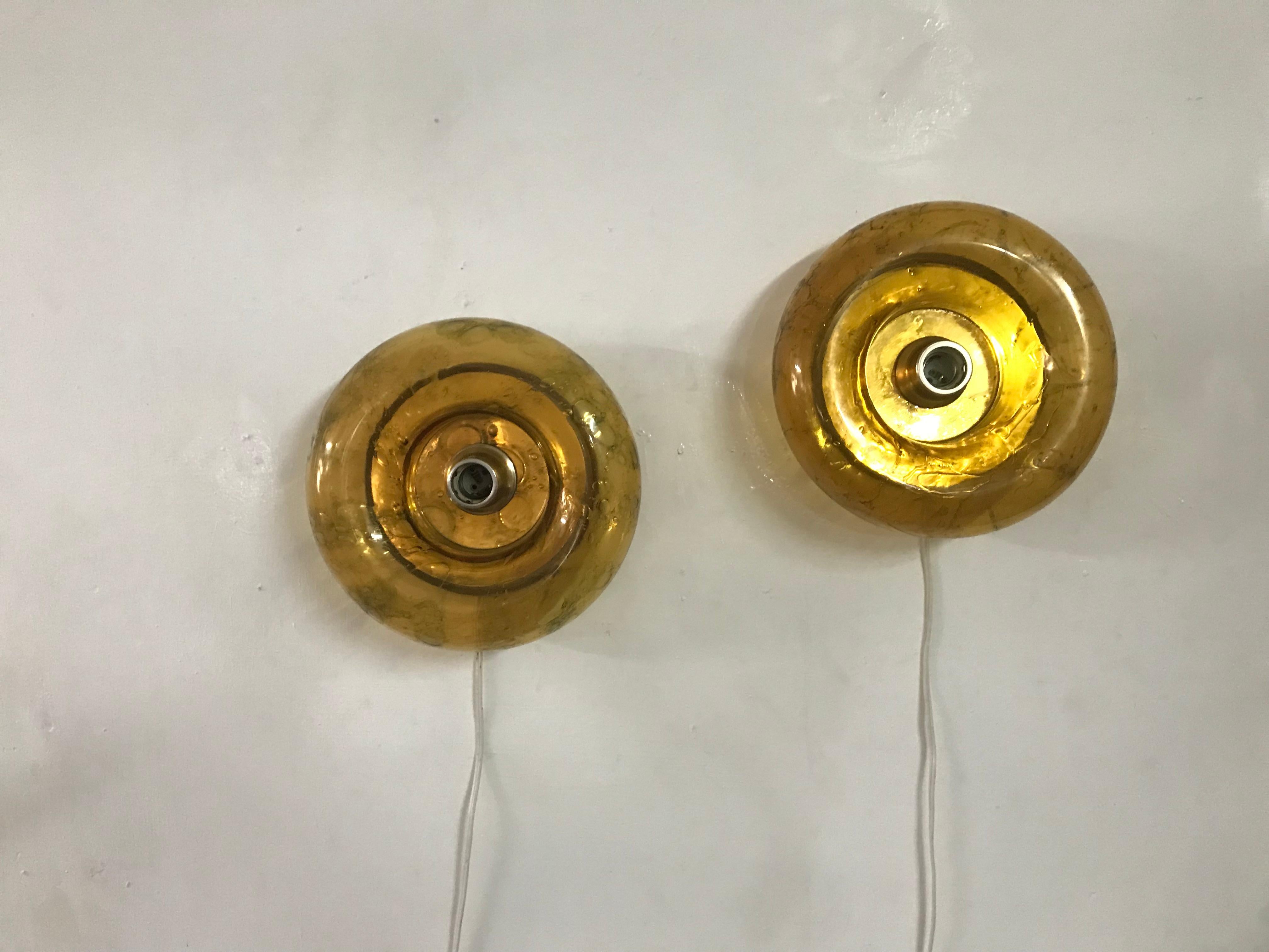 Pair of Space Age wall lamps or sconces, manufactured by Doria Leuchten in Germany in amber coloured blown glass and still retaining the original label.
Priced as a pair.