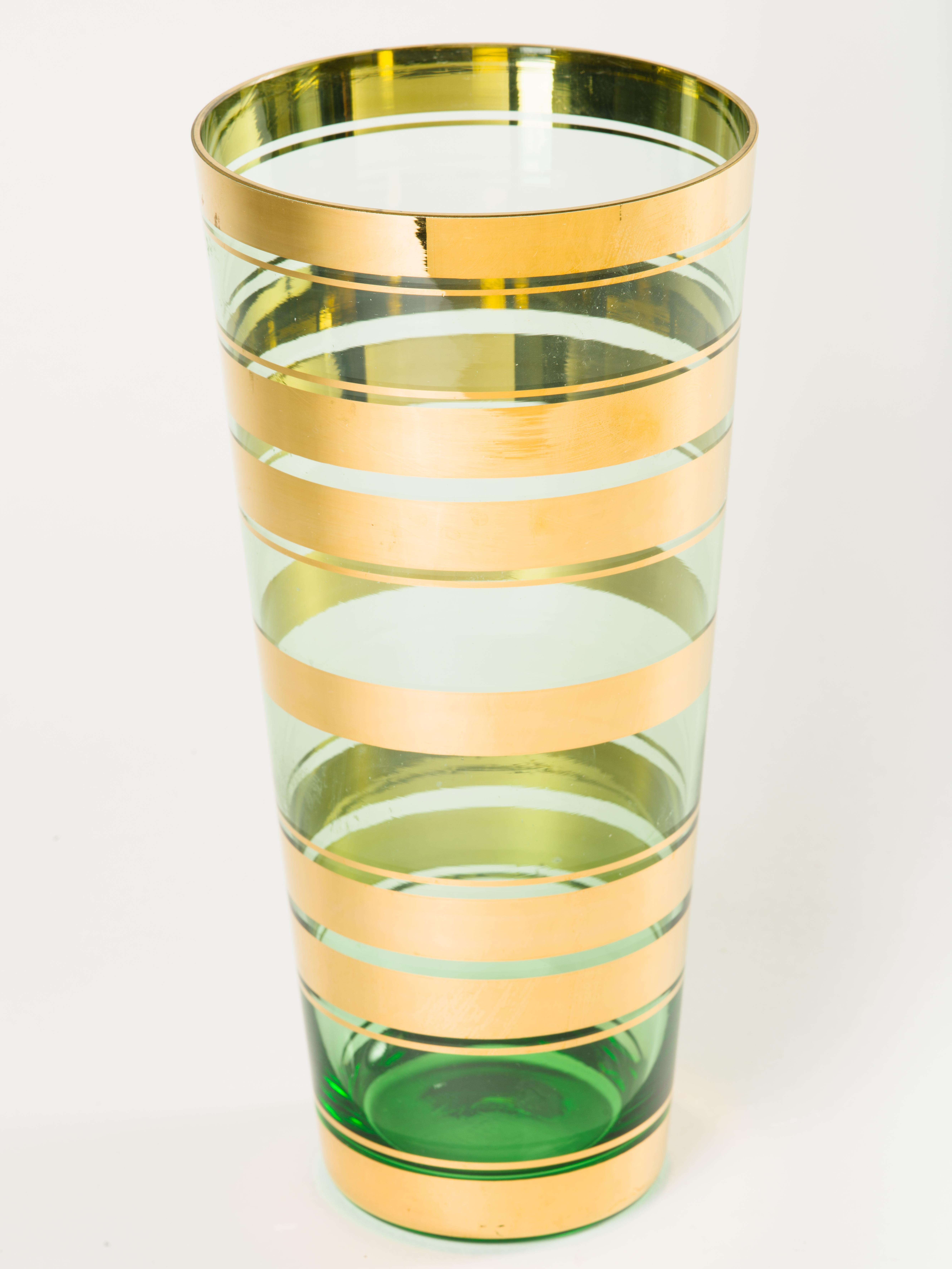 Vintage Czech Republic handblown art glass vase with tapered form. Features beautiful translucent green glass with 24-karat yellow gold rim details.