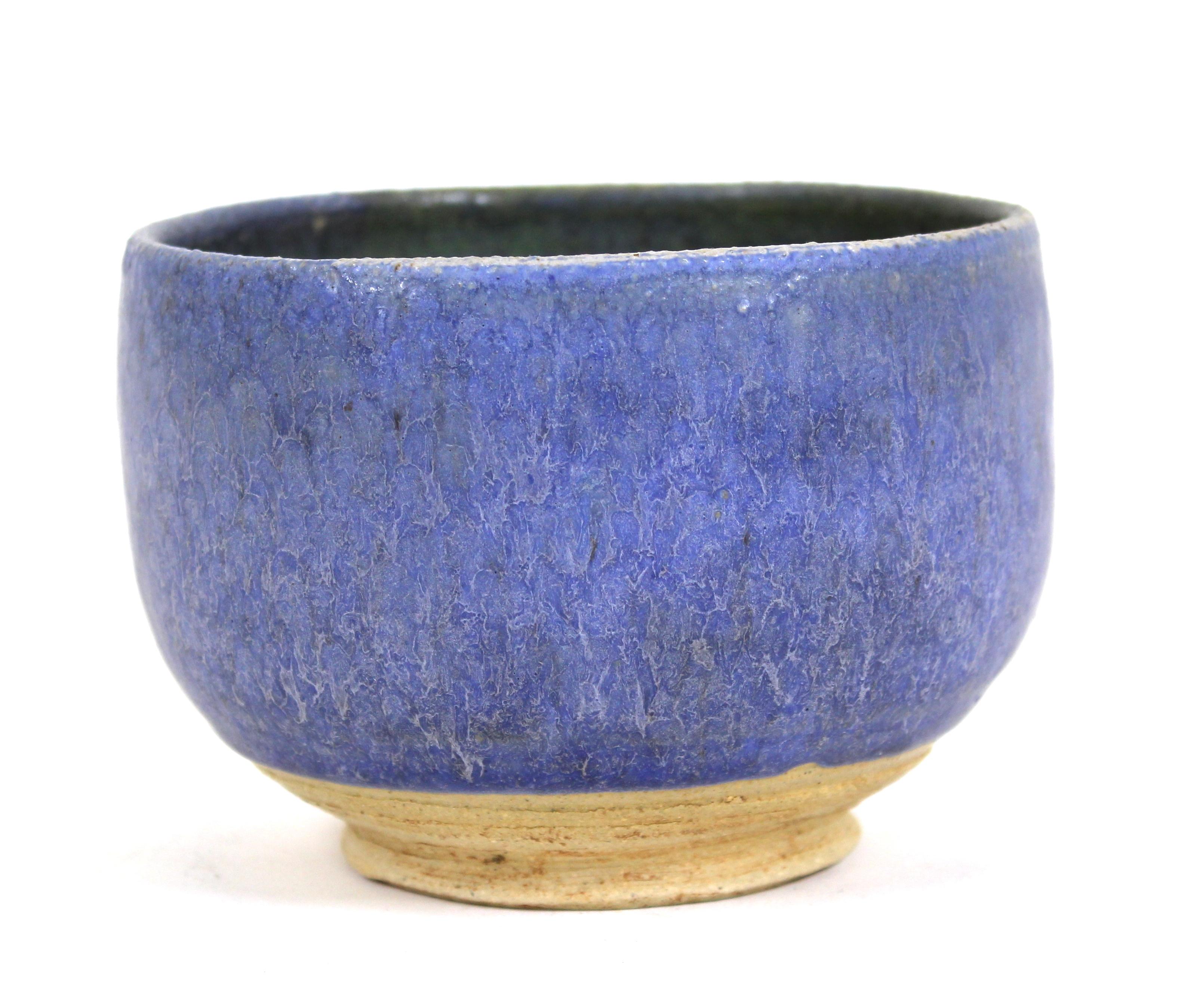 Mid-Century Modern stoneware pottery small bowl with blue outer glaze, marked illegibly on the bottom.