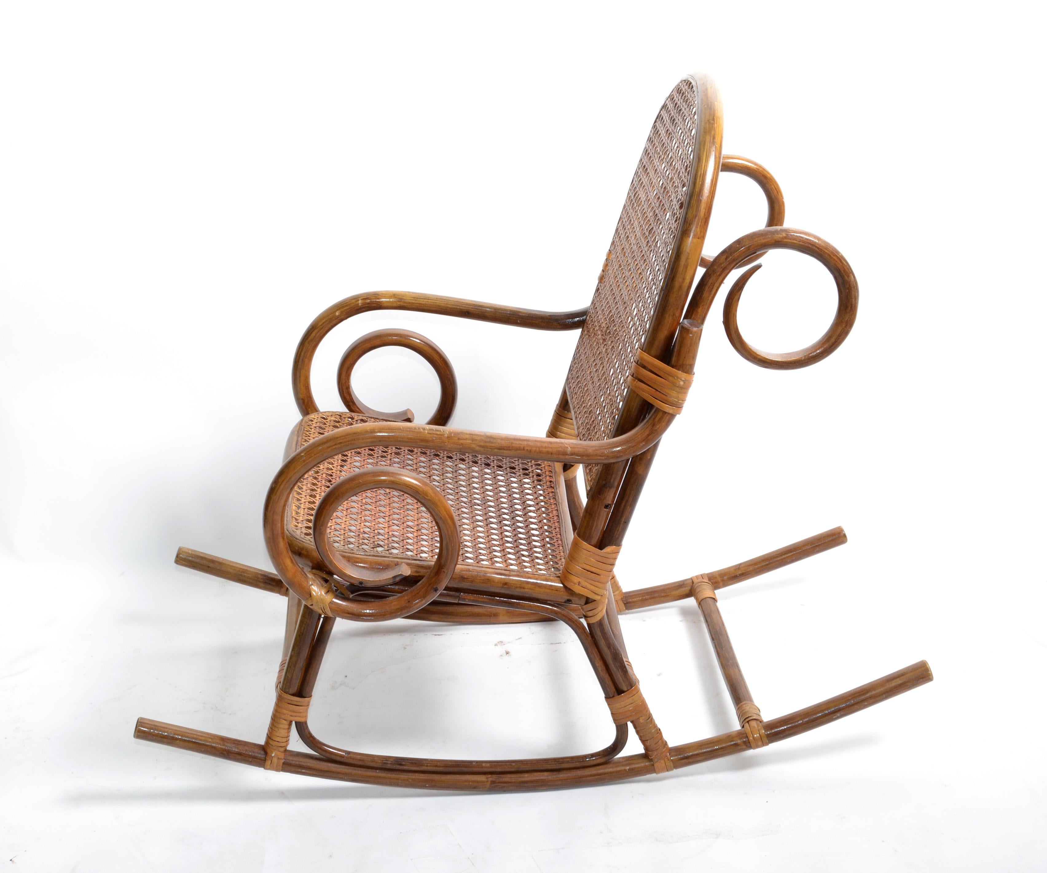 Cute Bohemian chic bamboo and cane children rocking armchair.
The chair is firm and sturdy, a fun item for your kids.
Measure: Arm height: 15 inches.

F-637-335