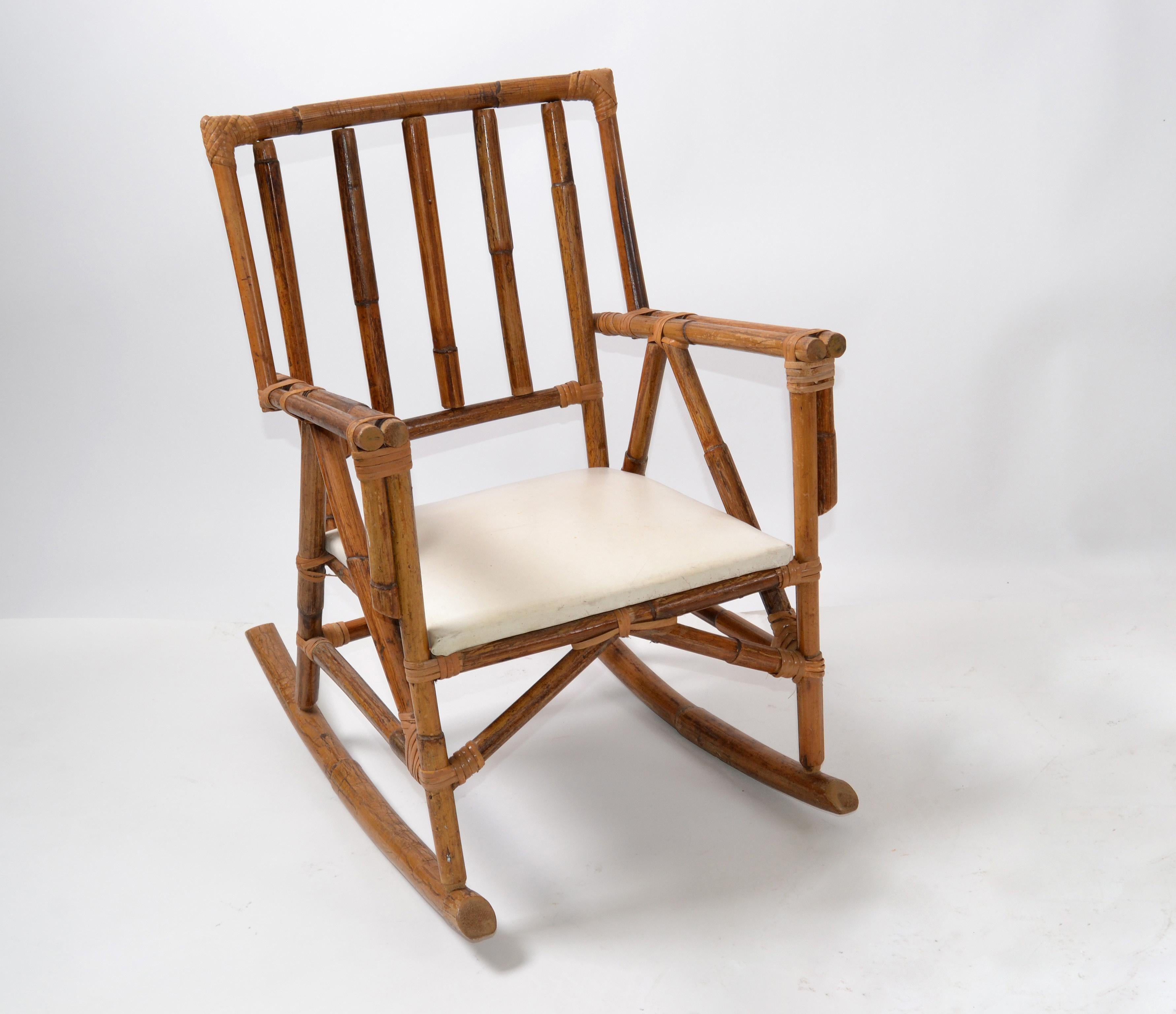 Cute bohemian bamboo and vinyl seat children rocking armchair.
The chair is firm and sturdy, a fun item for your kids.