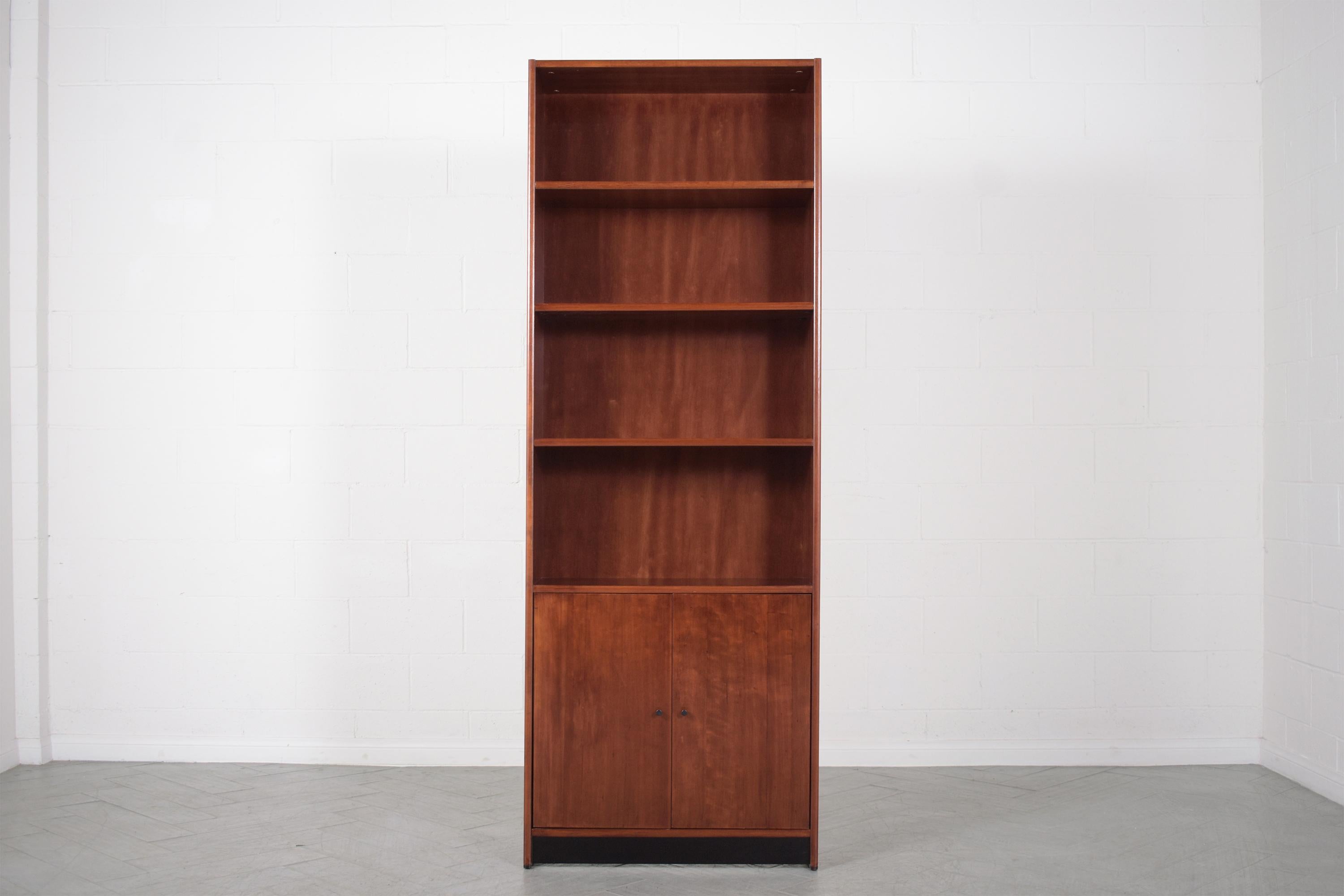 Dive into the charm of the 1960s with our exquisitely restored mid-century modern bookcase. Our expert craftsmen have taken this vintage wall unit and breathed new life into it, making it an embodiment of both function and beauty.

Boasting four