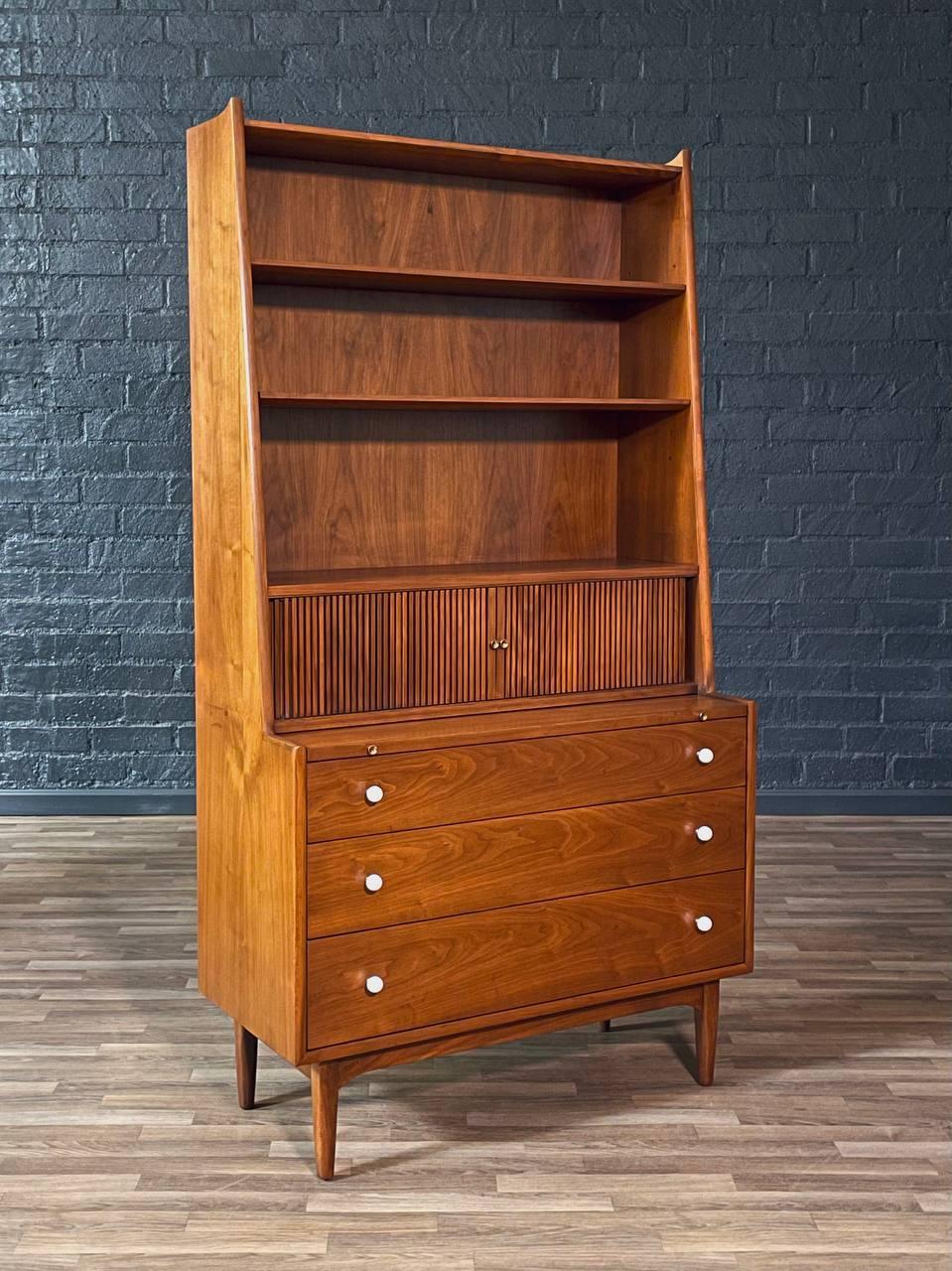Condition: Original Vintage Condition  

Materials: Walnut, Porcelain Pulls

Designed by Kipp Stewart for Drexel in the 1960s, this Mid-Century Modern hutch blends sculptural beauty with everyday utility. Crafted from rich walnut, it features open