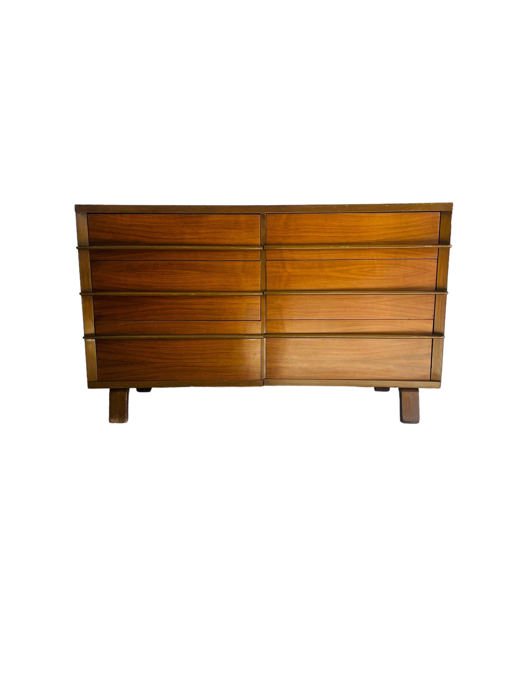 Introducing the Mid-Century Modern Walnut Bow Front Dresser/Credenza, a sleek and stylish storage solution that combines vintage charm with modern sensibility. Crafted from high-quality walnut wood, this exquisite piece features a bow Front Design