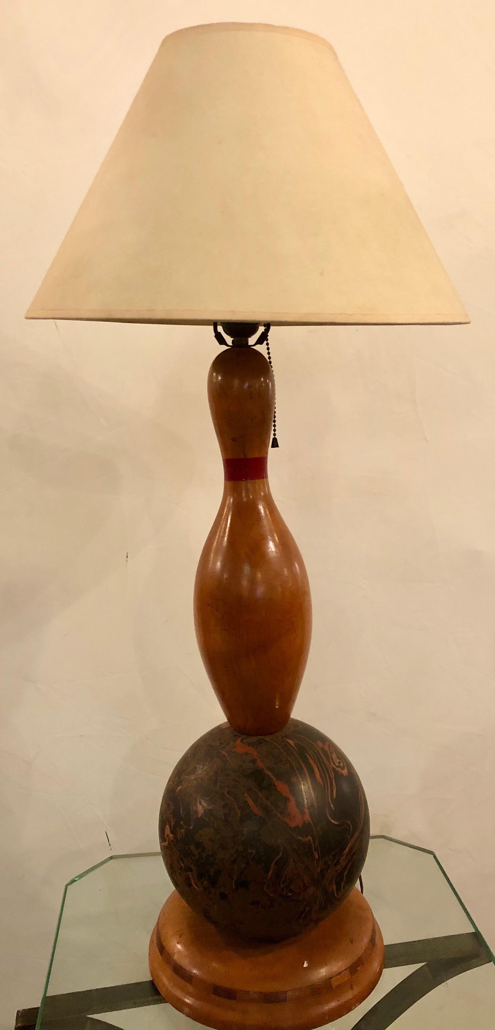 Bowling ball and pin Mid-Century Modern table lamp. An actual bowling ball and pin mounted as a decorative table lamp.