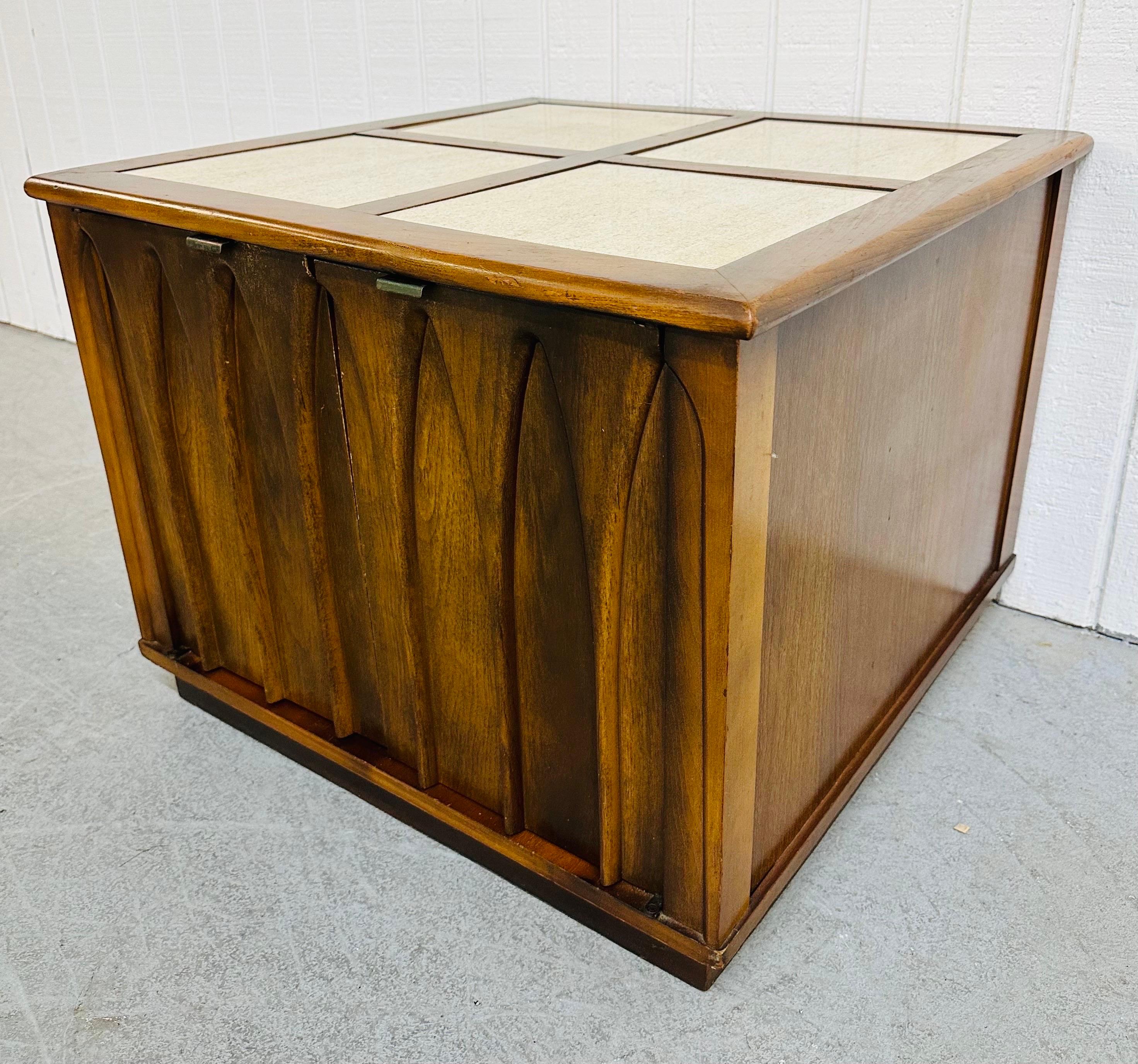 This listing is for a Mid-Century Modern Brasilia Style Walnut & Travertine Side Table. Featuring a straight line rectangular design, four travertine inserts on the top, two doors that open up to storage space, and a beautiful walnut finish. This is