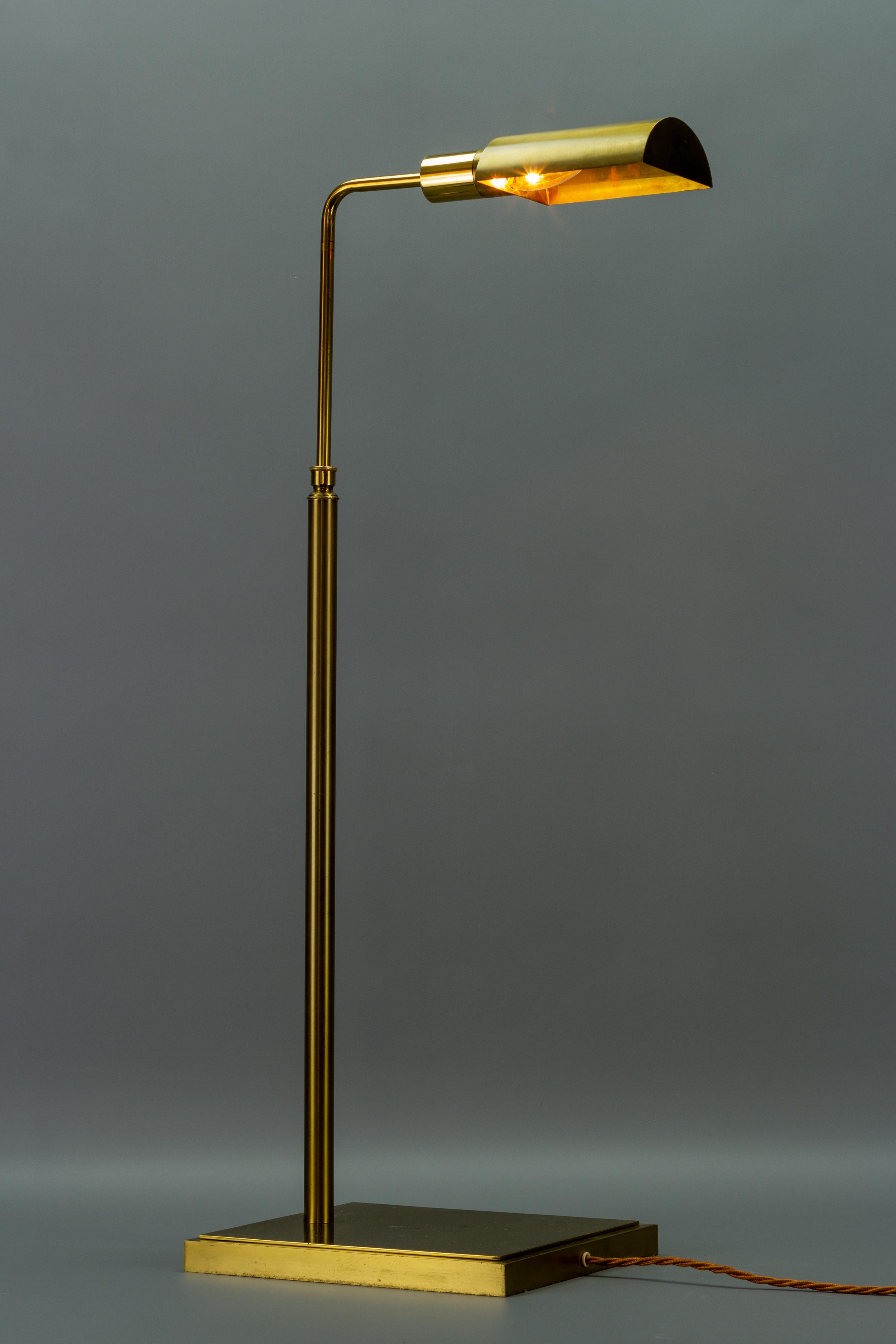 An elegant Mid-Century floor lamp, made of brass, Europe, the 1970s. Adjustable height from circa 71 cm / 27.95 to circa 121 cm / 47.63 in.
One socket for an E14-size light bulb.
The light fixture is in complete working order, but as with all