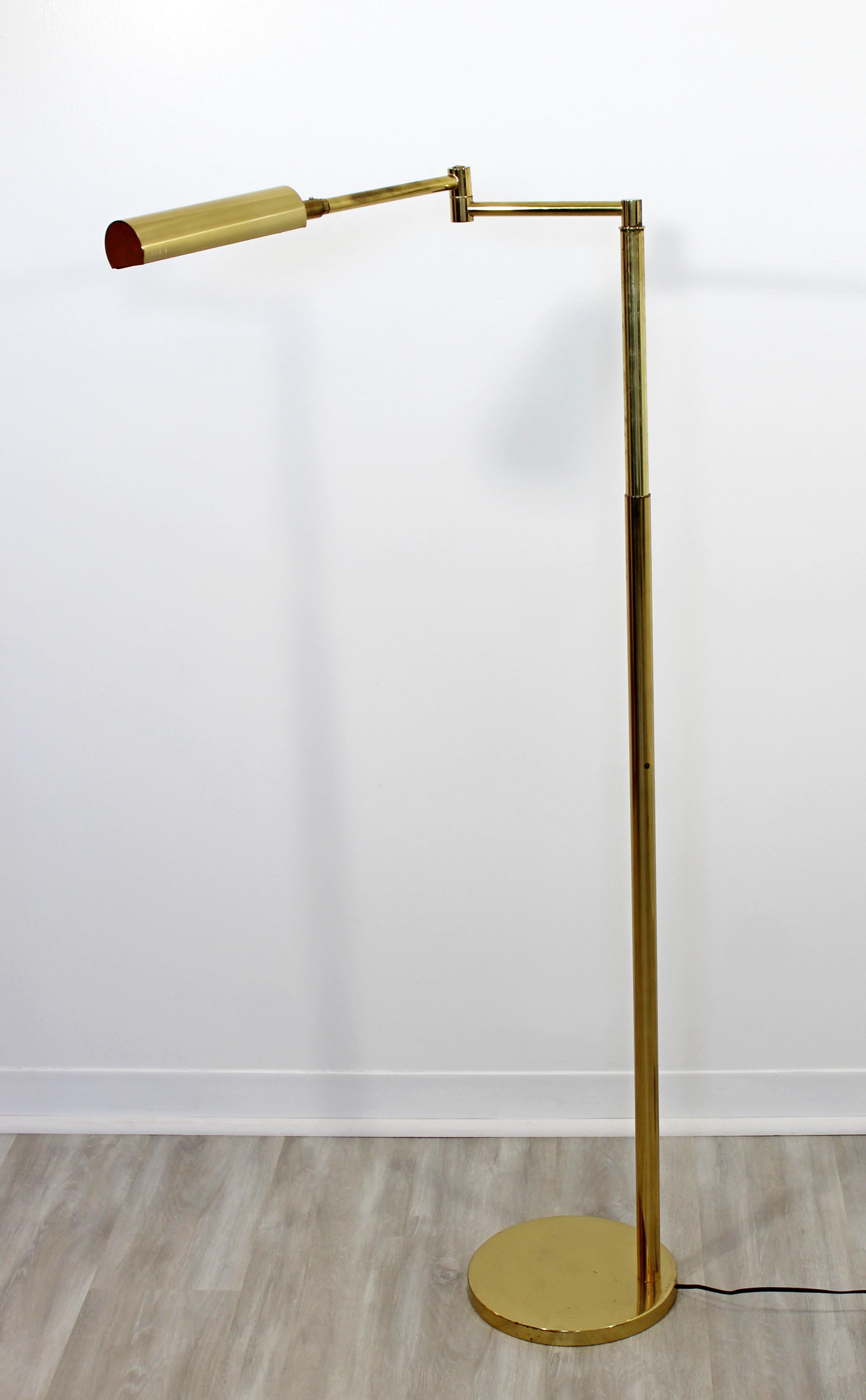 For your consideration is a fantastic, brass, adjustable reading floor lamp by Koch & Lowy, circa the 1970s. Adjustable stem and rotating shade, with dimmer switch. In excellent condition. The dimensions are 10