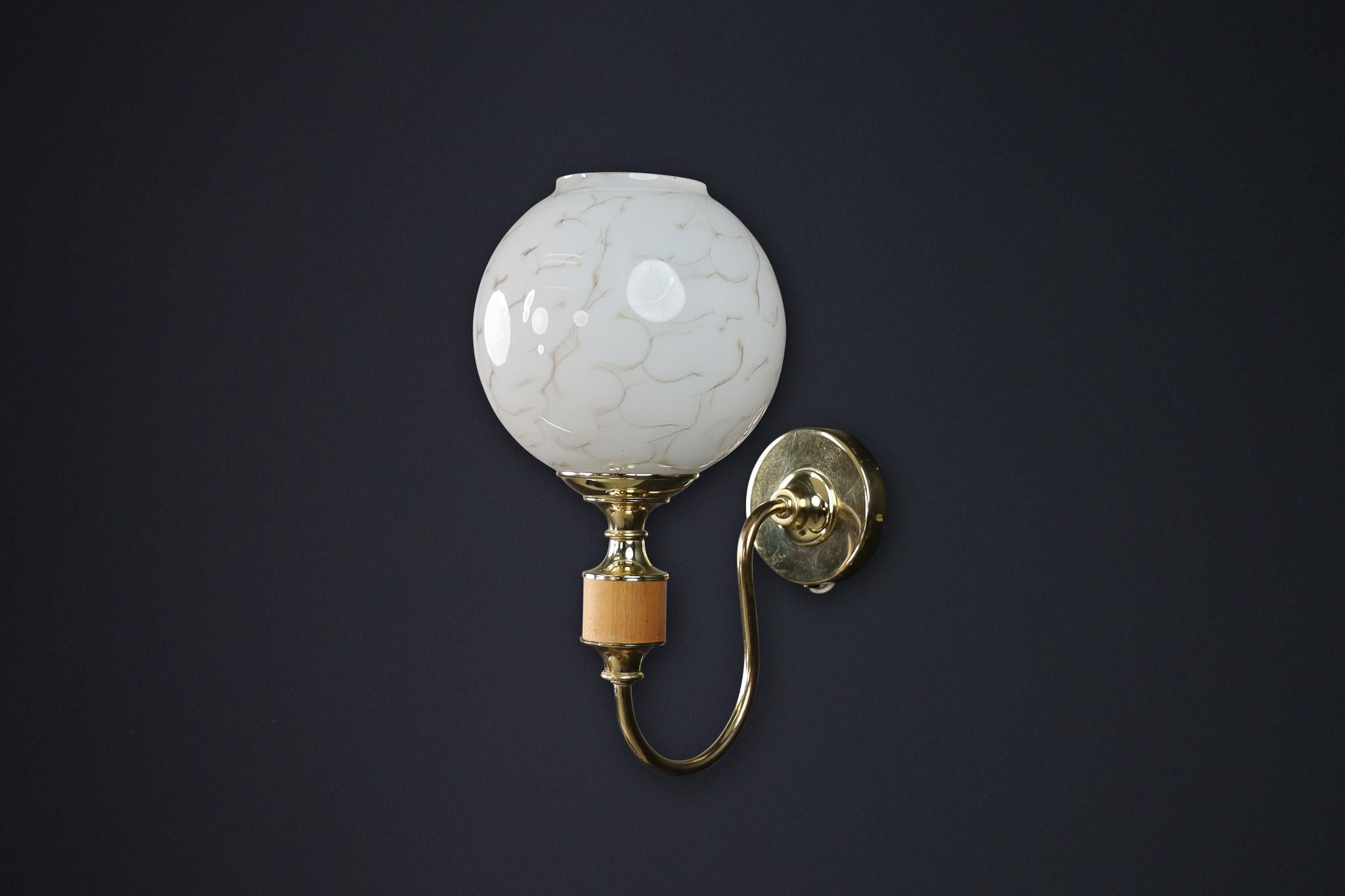 Mid-Century Modern Brass and Art Glass Wall Sconces, Czech Republic 1970s

This striking pair of wall sconces exemplifies the clean lines and sculptural form associated with Mid-Century Modern design. Produced in Czech Republic during the 1970s,