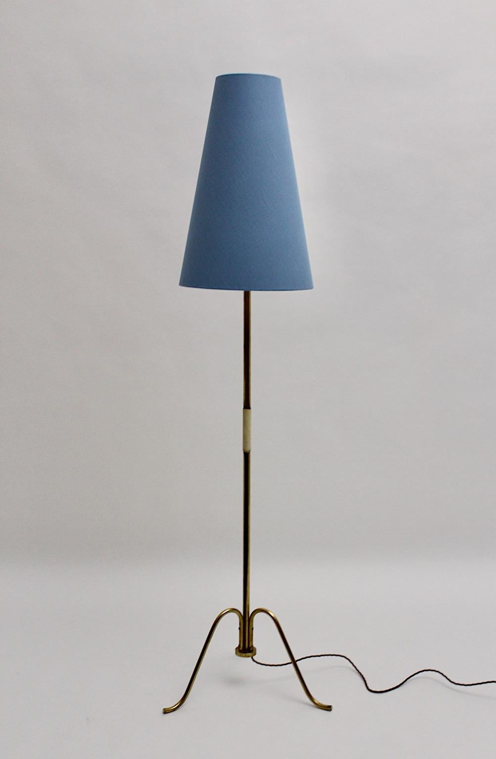 Mid-Century Modern vintage floor lamp from brass tube designed and manufactured in Vienna, Austria, 1950s.
While the brass tube stem is partly wrapped with white plastic string as handle, the conical shaped renewed lamp shade is covered with
