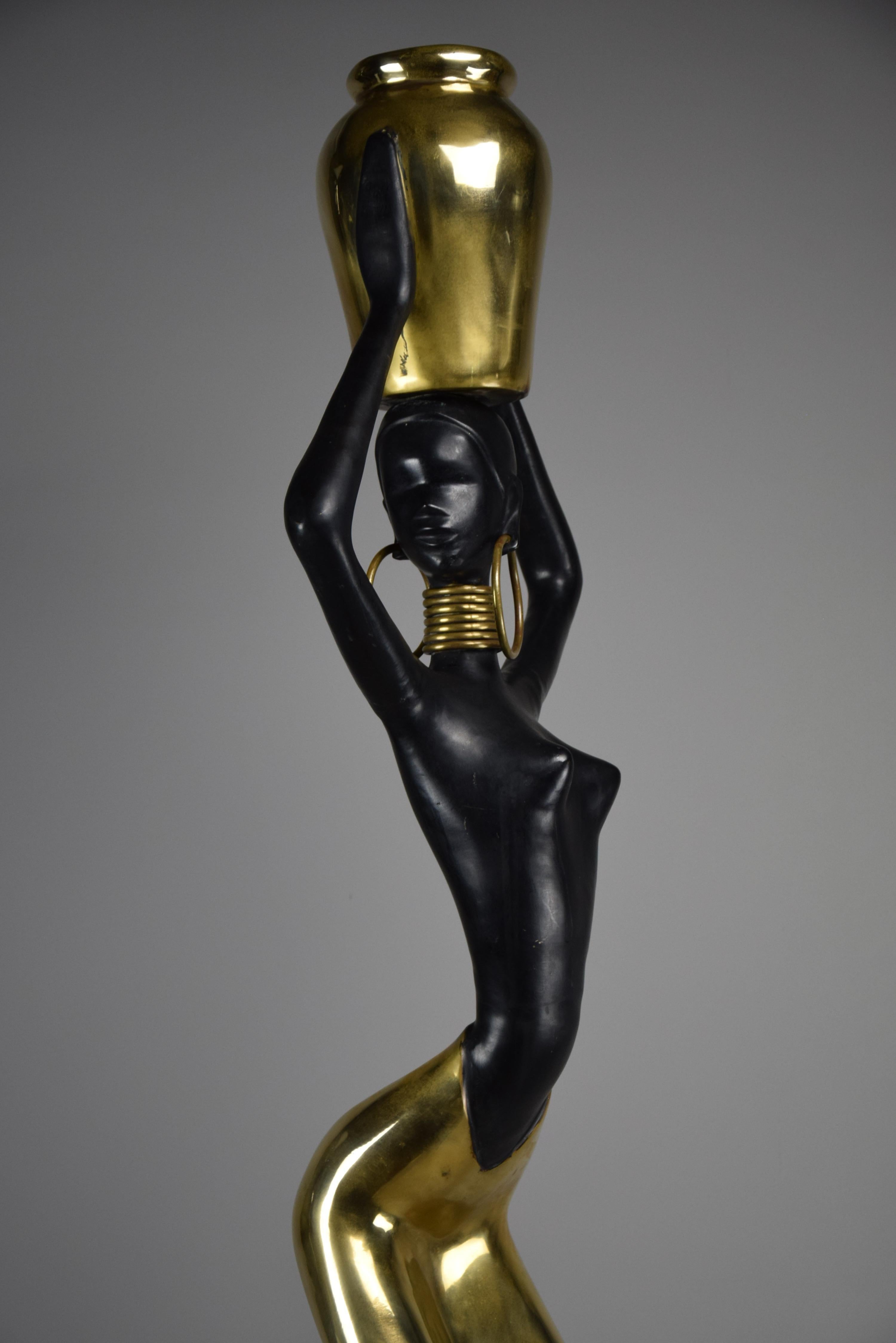Captivating Mid-Century Modern Sculpture

Elevate your space with this stunning 168 cm brass and copper sculpture, a mid-century modern masterpiece inspired by the timeless elegance of Karl Hagenauer's works. This exquisite piece captures the grace