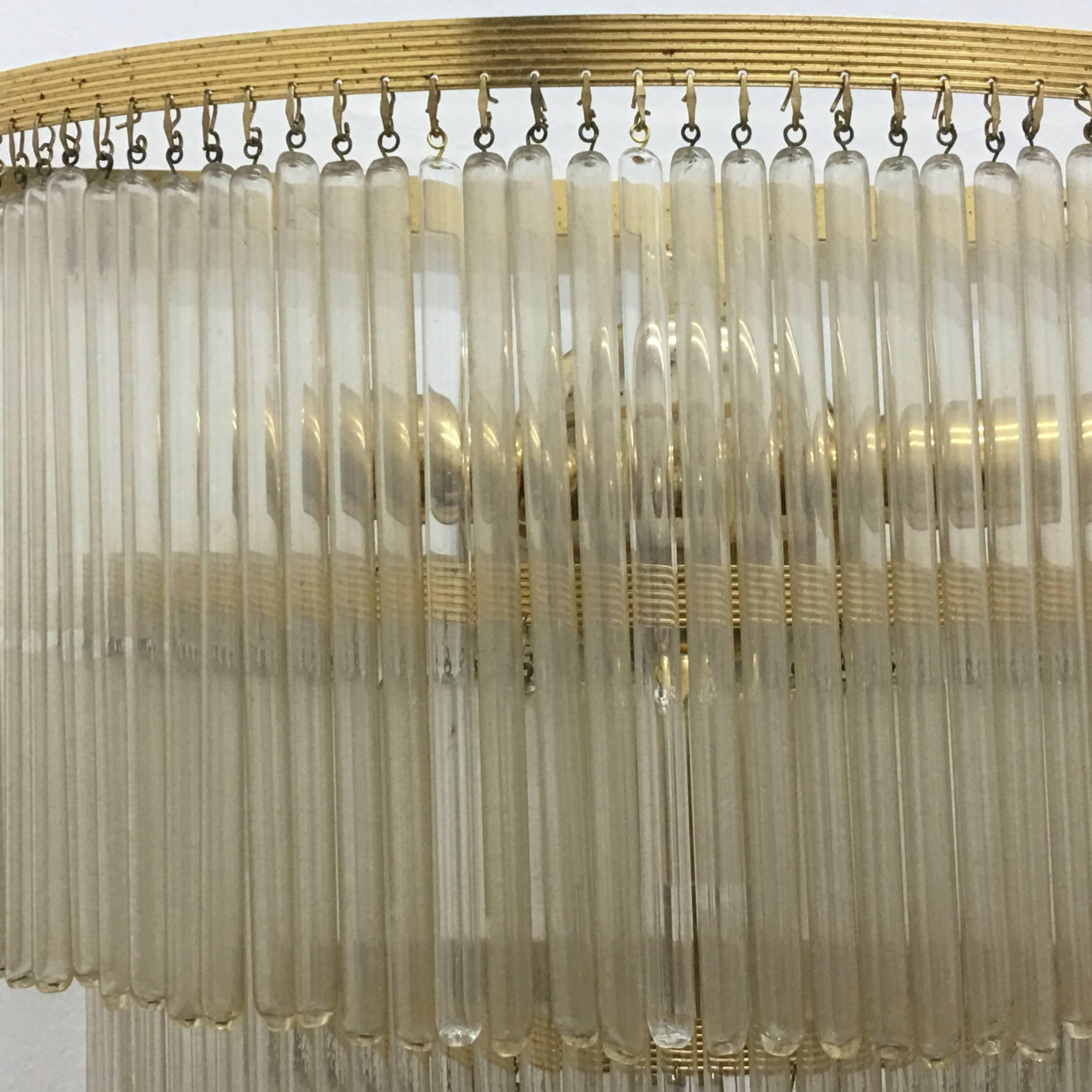 This is a large brass and glass wall light made in Italy in the 1950s, complete in all parts. 
It works with both 110 and 220 Volt and needs regular e14 bulbs