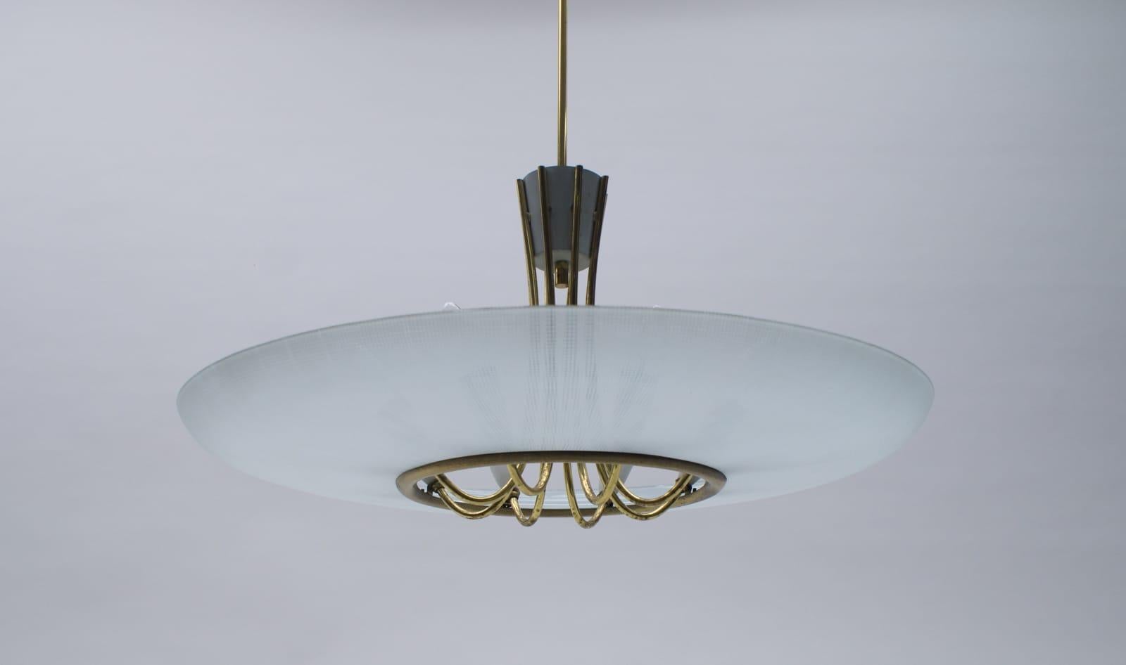 Very reminiscent of Fontana Arte. Very elegant and decorative hanging lamp from the 1950s. Probably, Italy.

The lamp comes with eight E14 Edison screw fit bulb holder. They are with original wiring in working condition and run both on 110/230