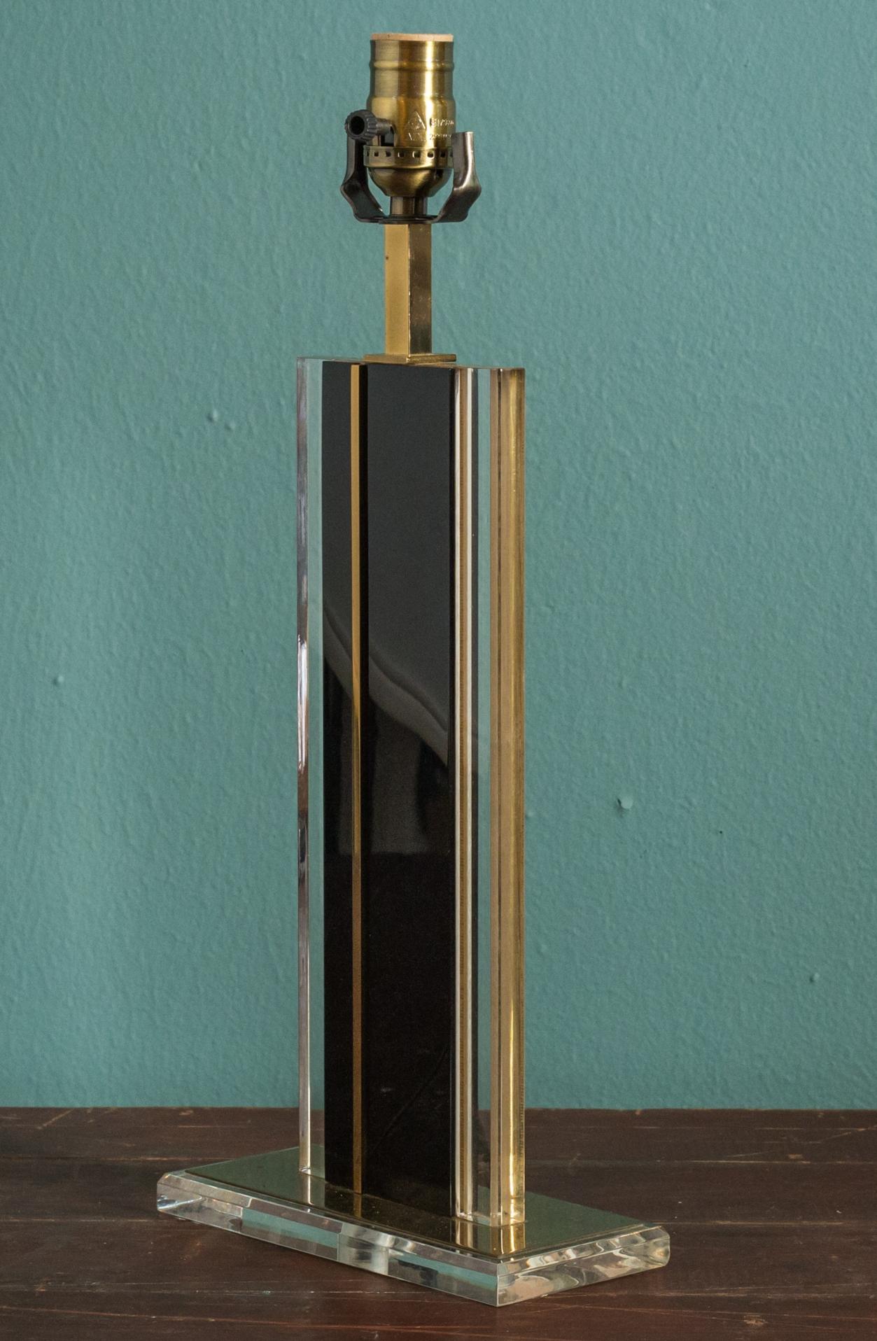 Mid-century brass and glass lamp: this handsome and unusual table lamp is fabricated from plates of clear glass, black glass and brass. Newly wired for use within the USA. Sold without a shade (listed height is measured to top of socket).
